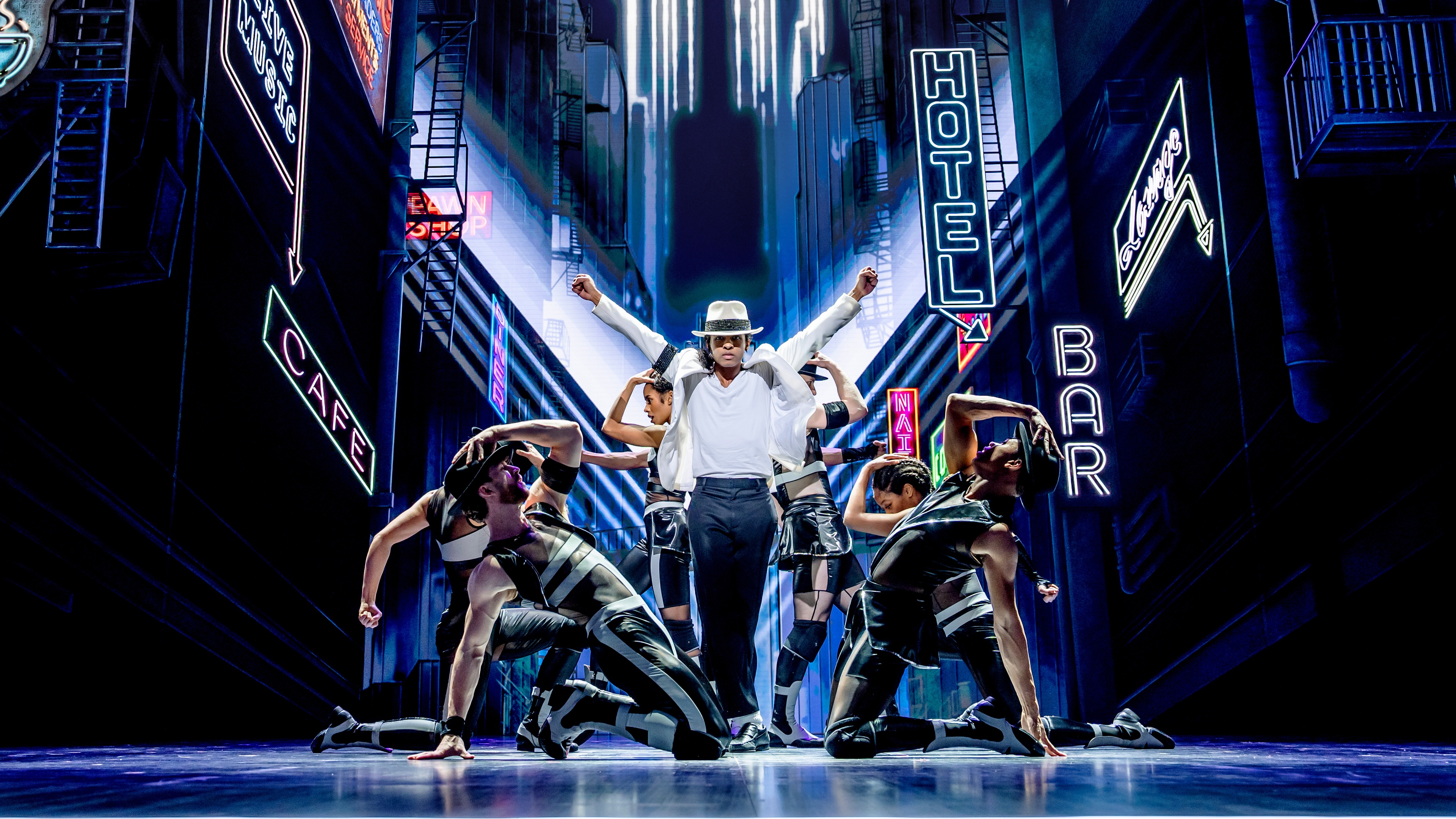 MJ the Musical performers on stage with blue lighting