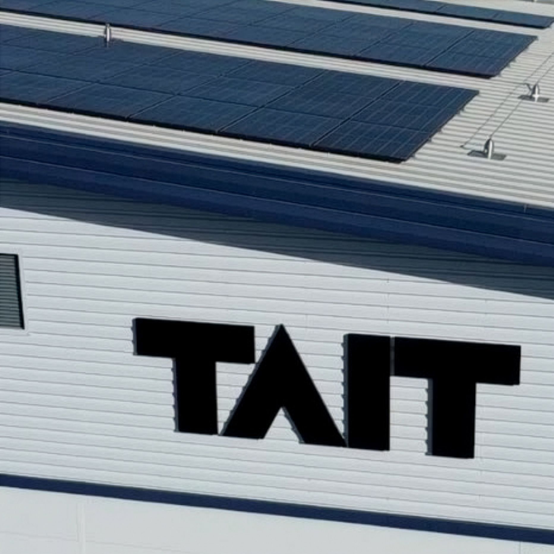 Large cladded building with TAIT logo