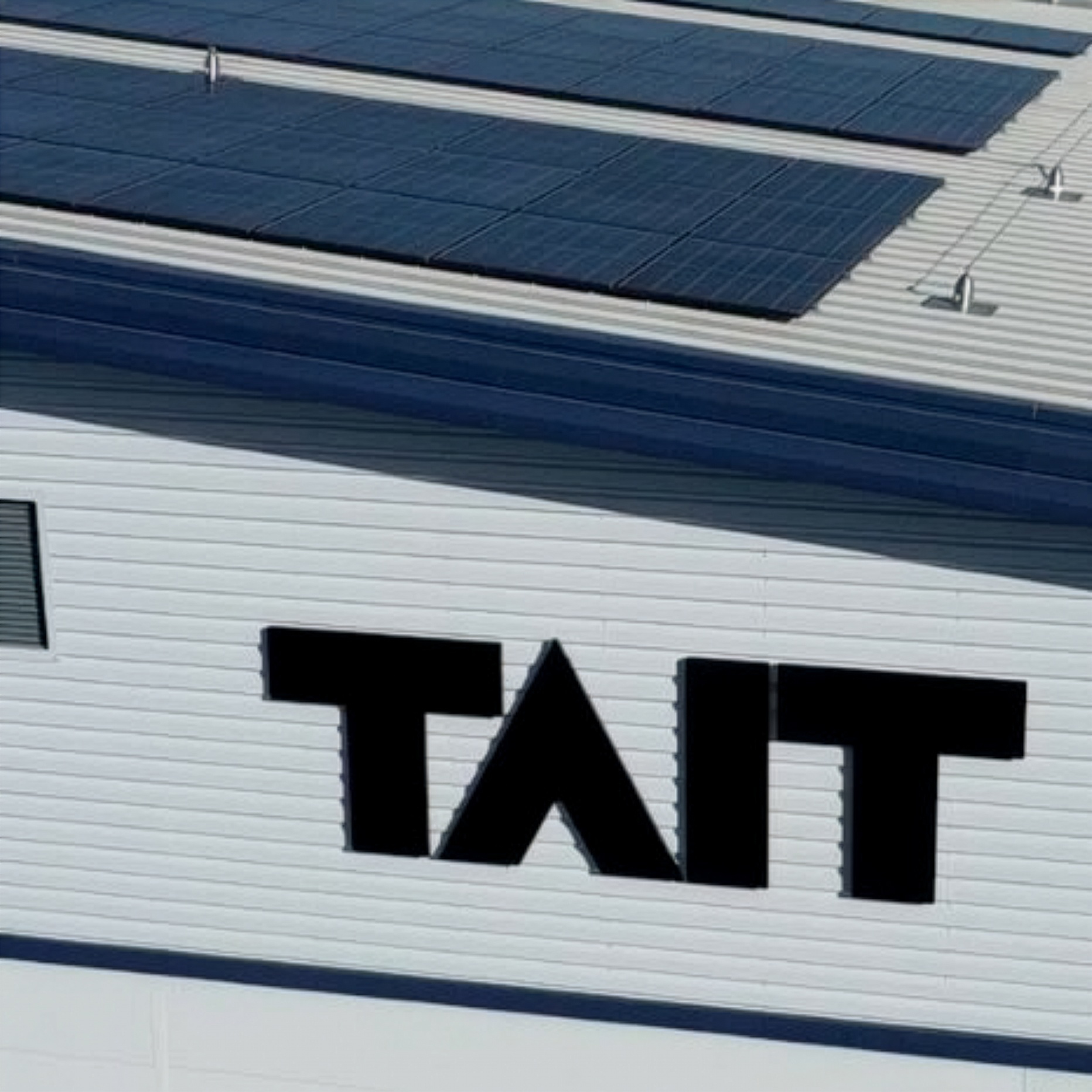 Large cladded building with TAIT logo