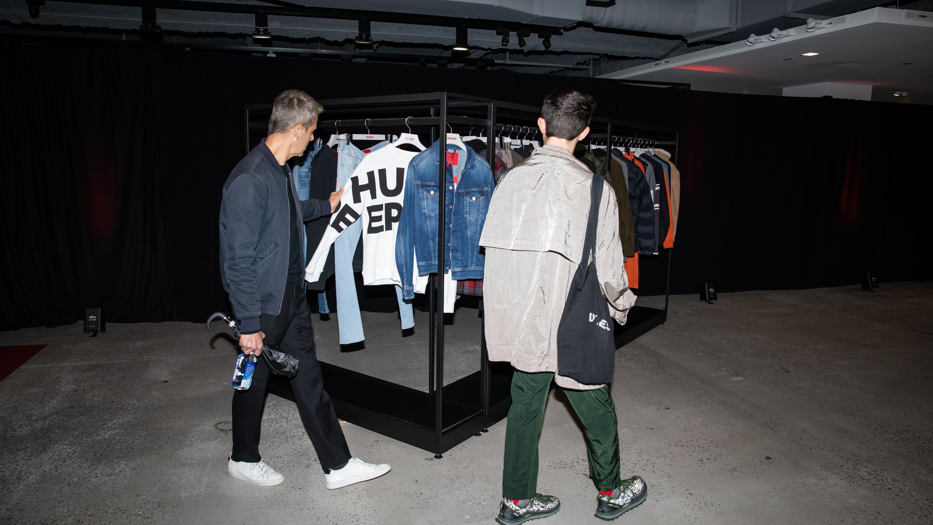 Two men looking at merchandise