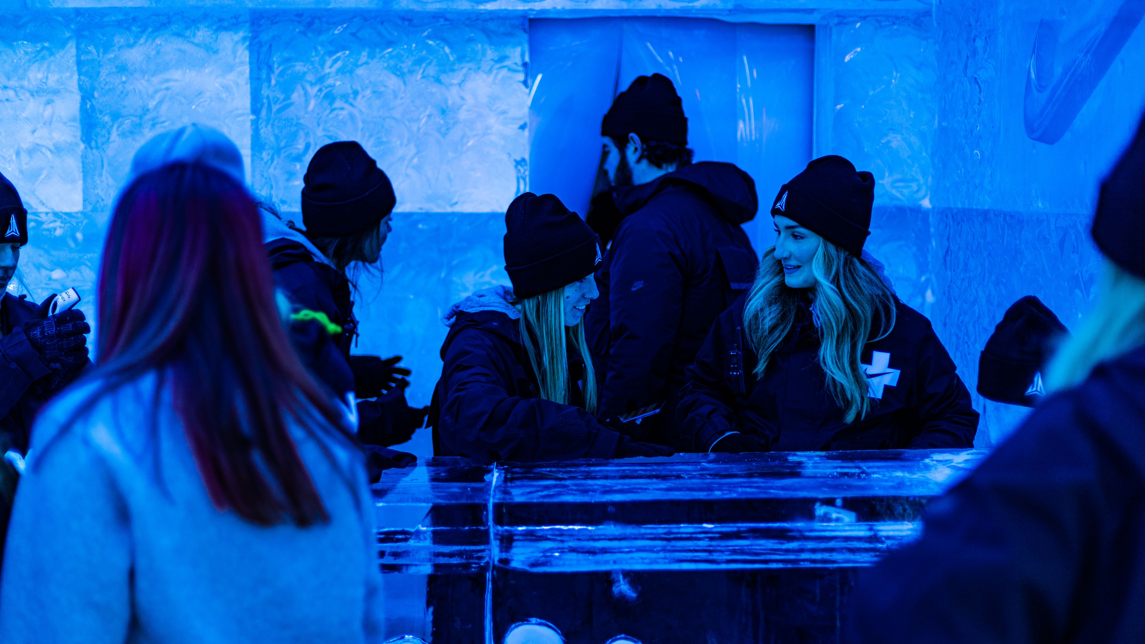 People gathering at brand activation ice theme blue lighting