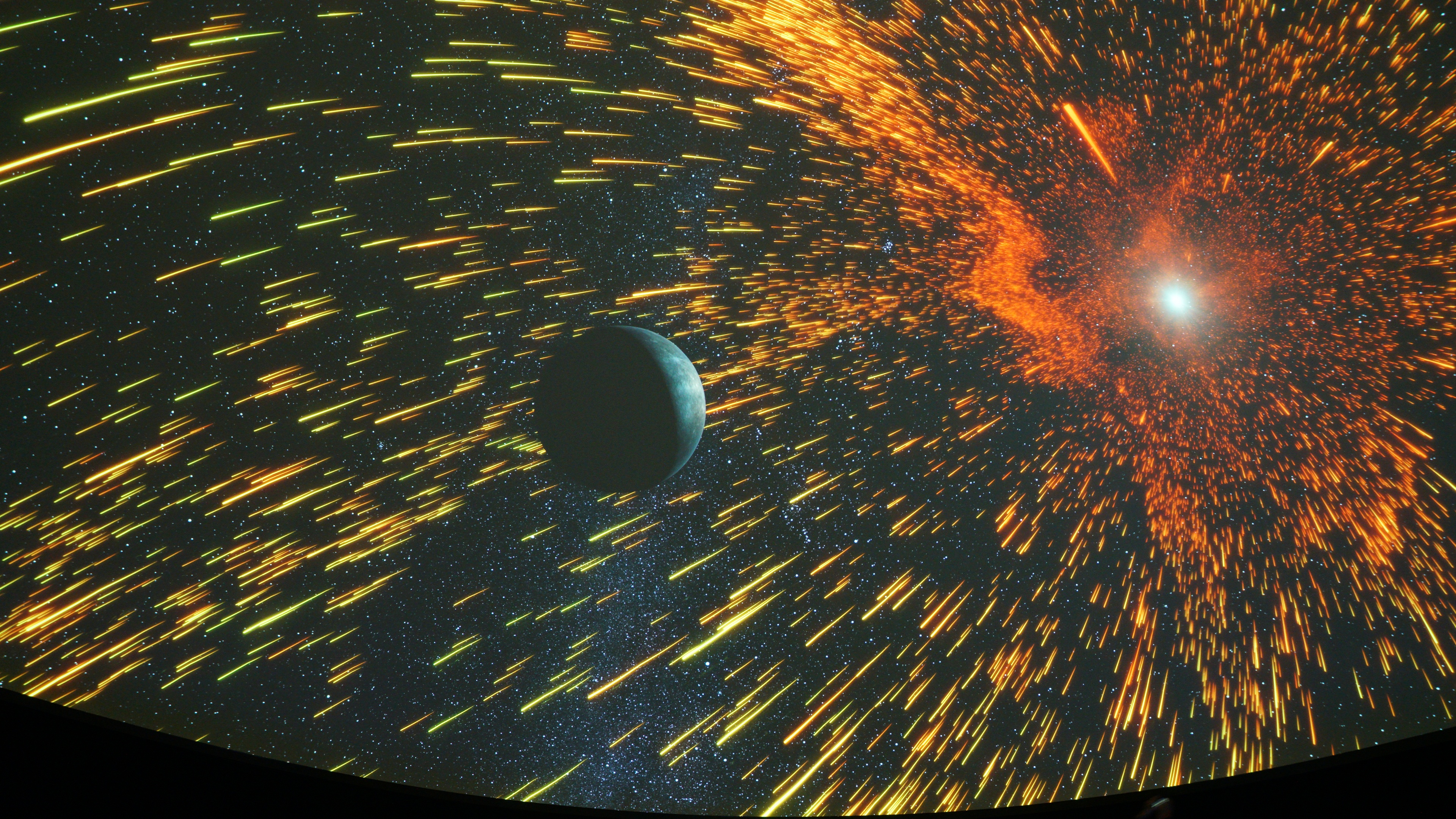 Planetarium screen with planets and stars
