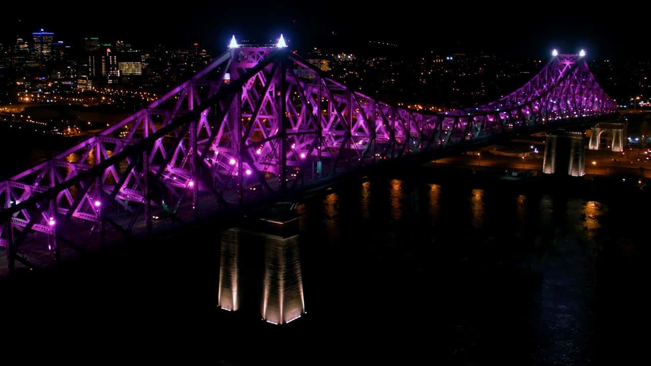 Bridge at night with magenta lighting