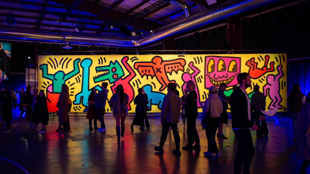 Luna luna Forgotten Fantasy Crowd in front of Keith Haring mural
