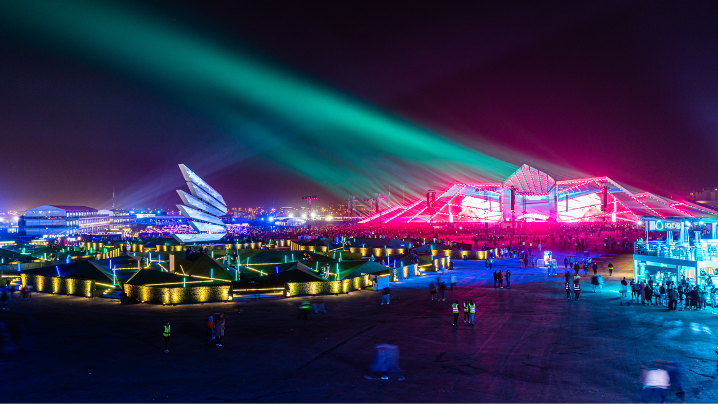 landscape image of soundstorm festival at night with a variety of colorful lights