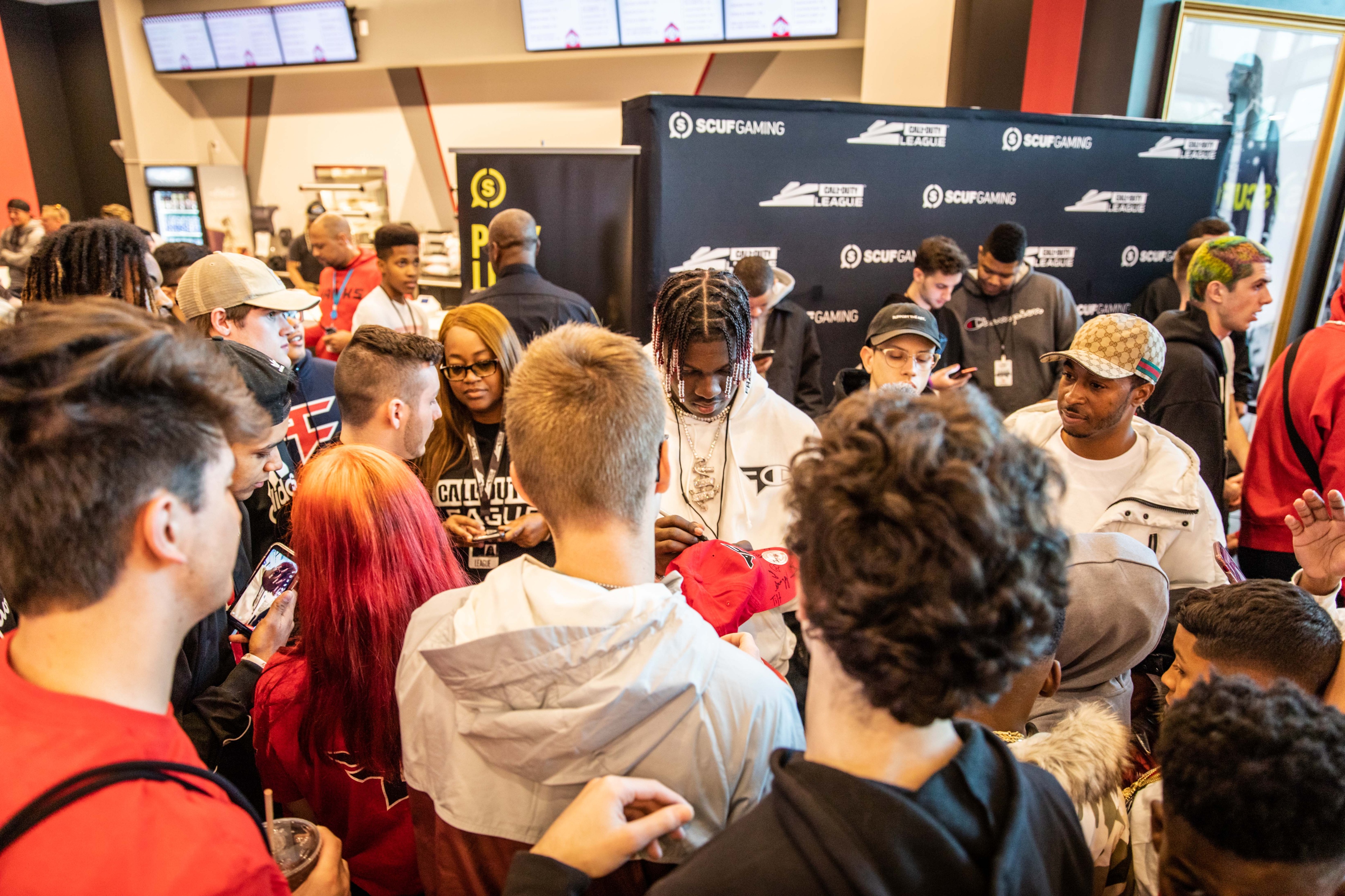 Lil Yachty signing merch for fans