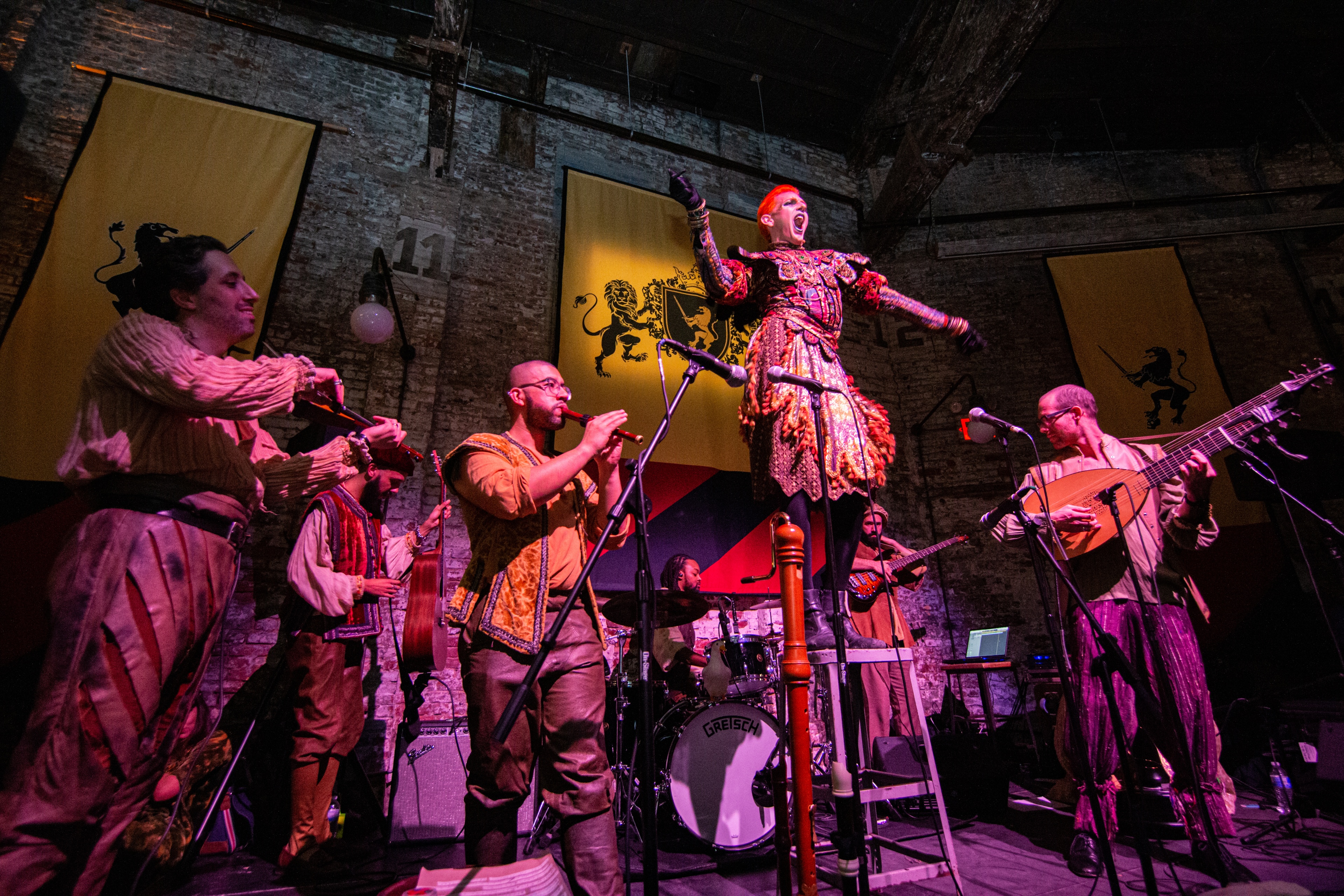 Band on stage dressed in medieval attire
