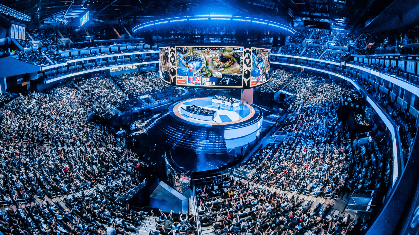 panoramic shot of the stadium seating surrounded video game players at the center