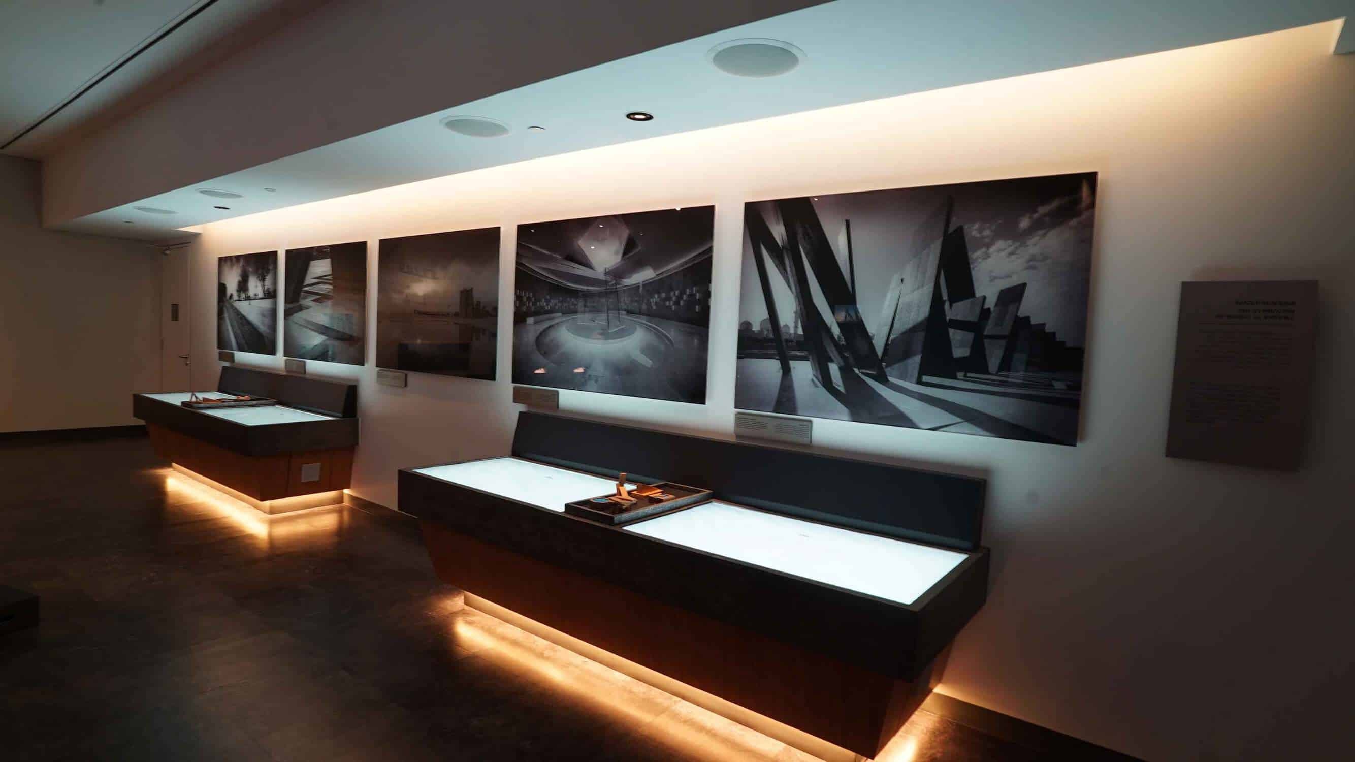 Visitor center with pictures on wall and LED screens