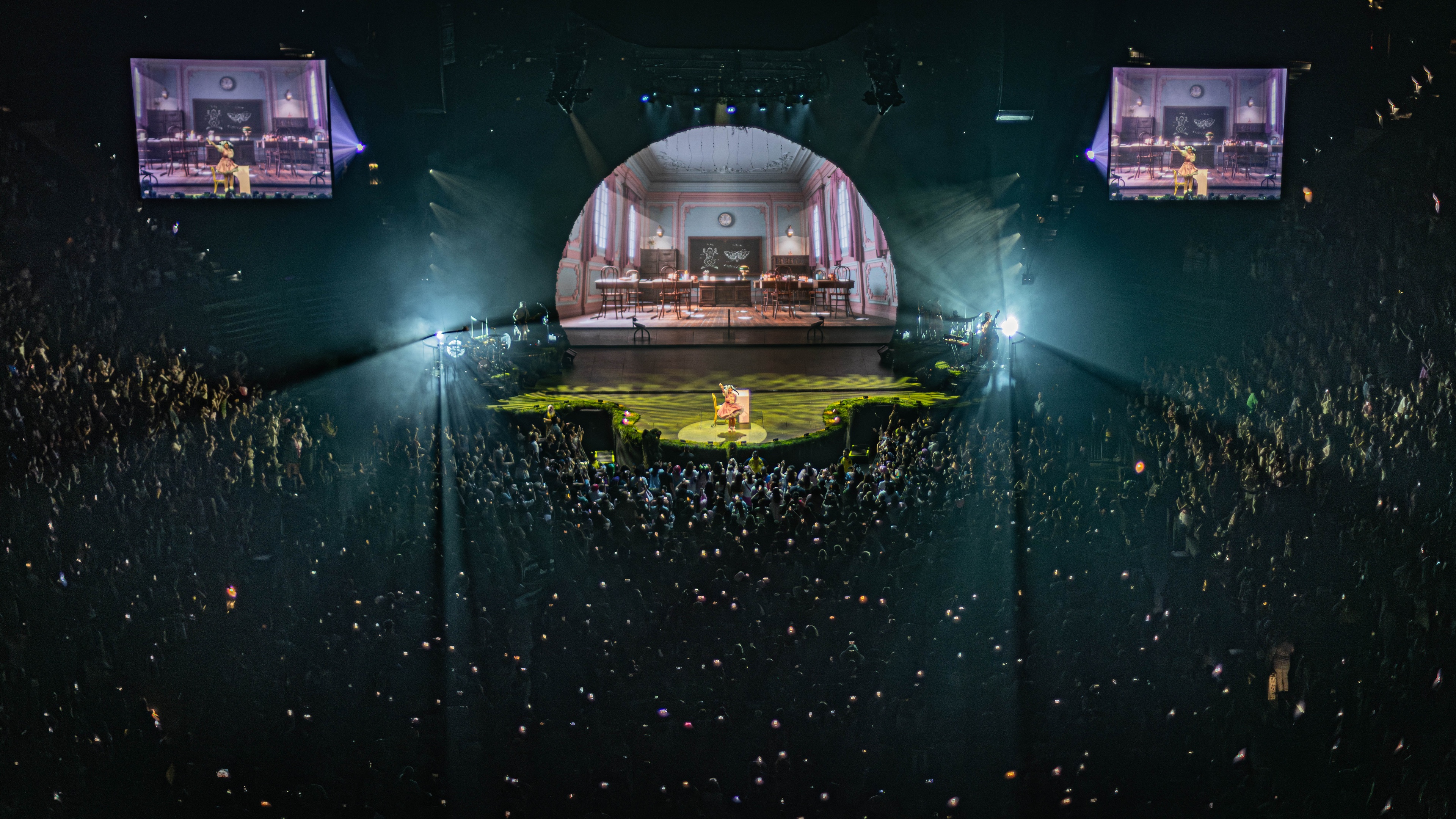 Large arena crowd with stage in center