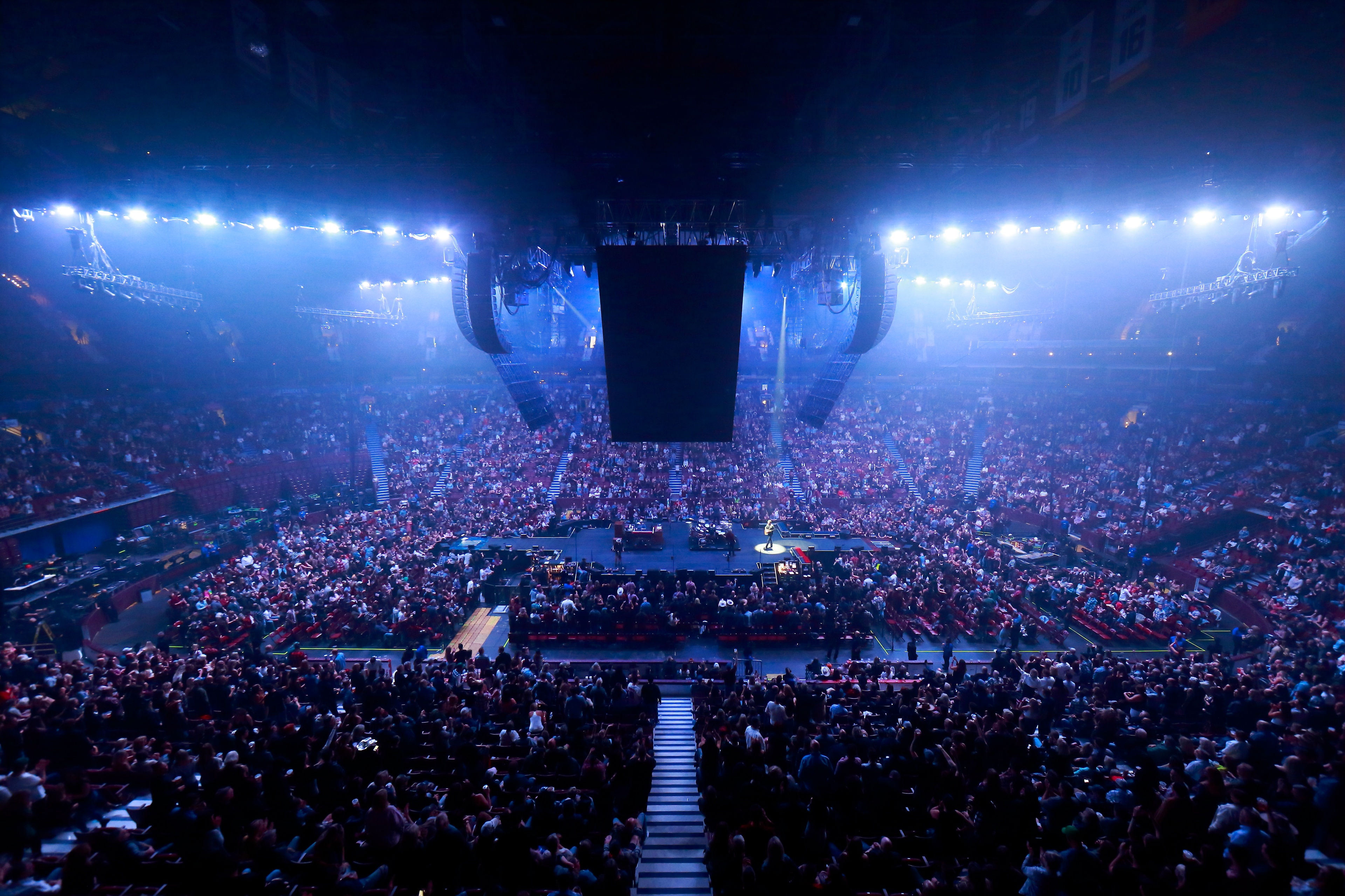 Bird's eye view of Eric Church performing on stage and crowd around it during the Gather Again Tour