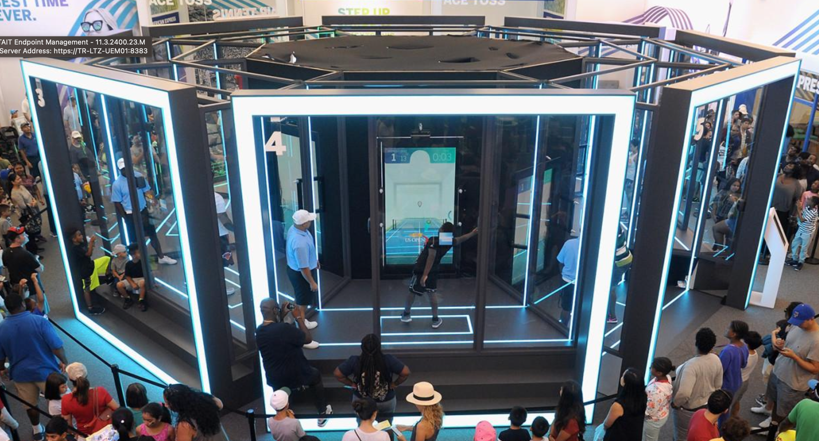 Boy in virtual realty simulator with crowd around him