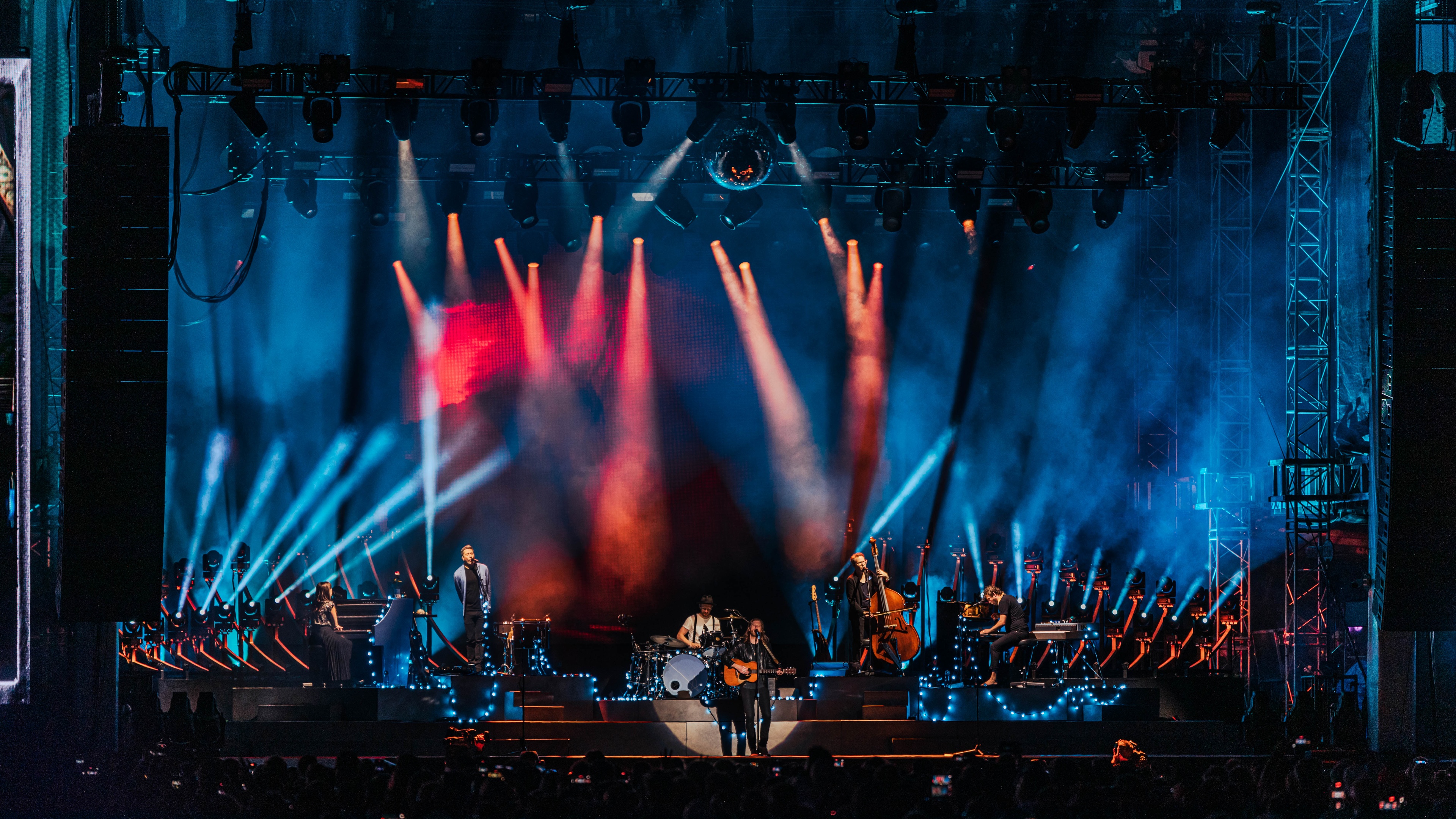 Band performing on Sound on Sound stage with blue and red lighting