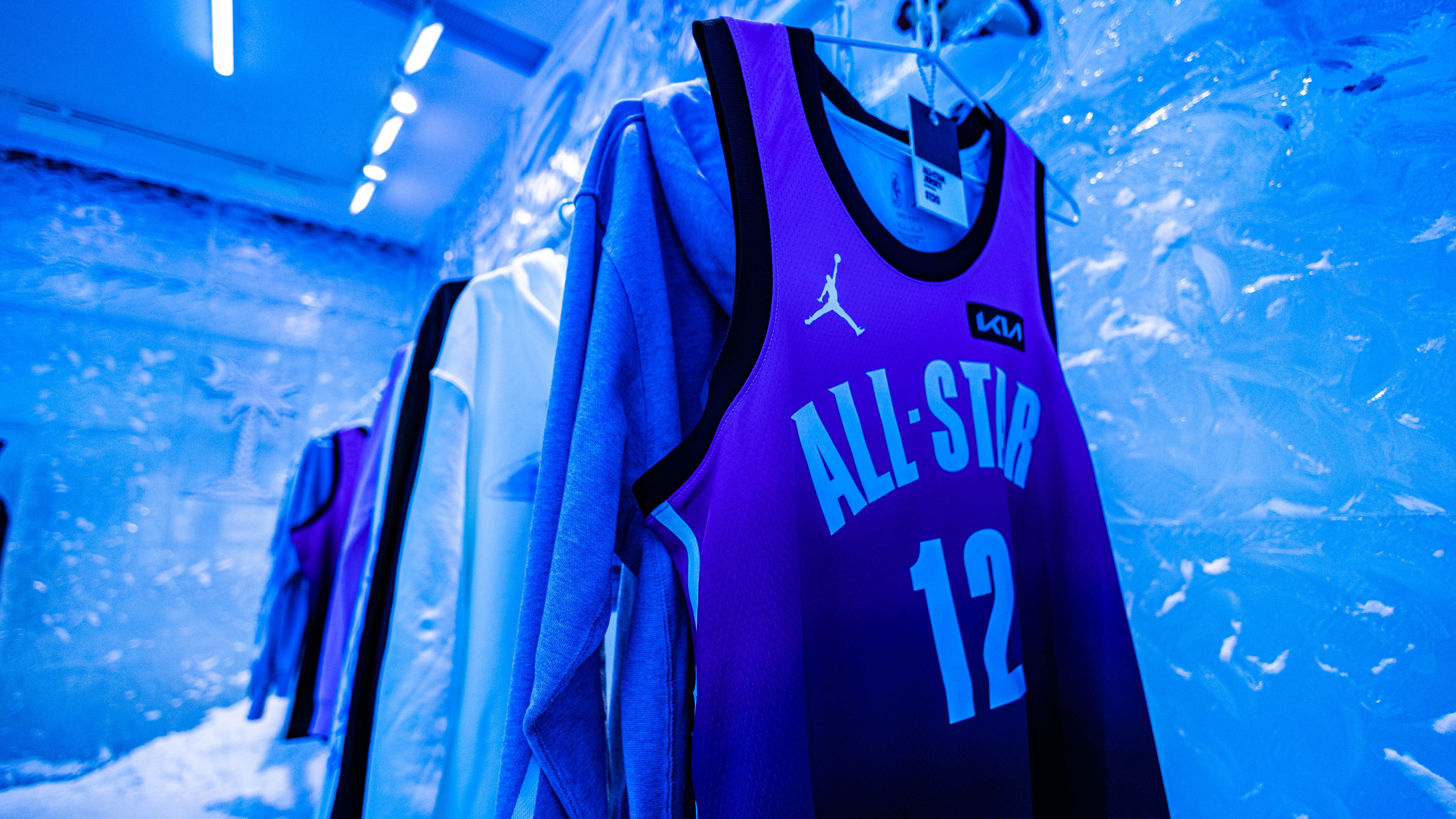 Range of basketball jerseys in frozen environment blue lighting