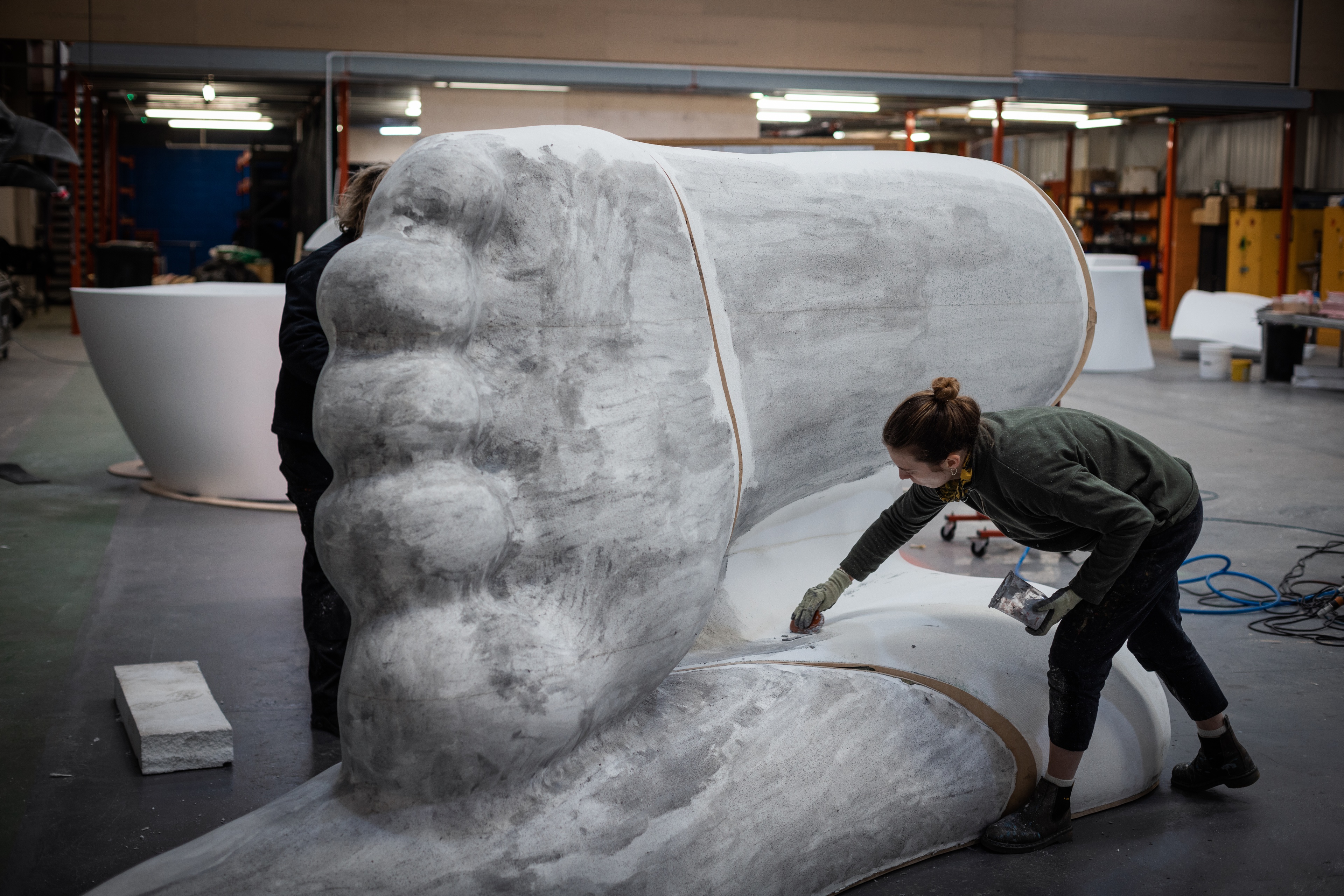 TAIT team member working on Gloria sculpture foot