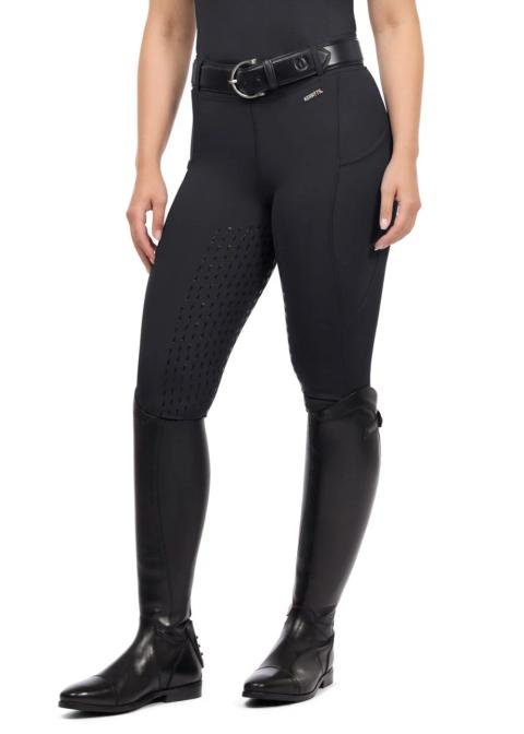 Kerrits Coolcore silicone full leg women's riding tech tight in black, worn with tall boots