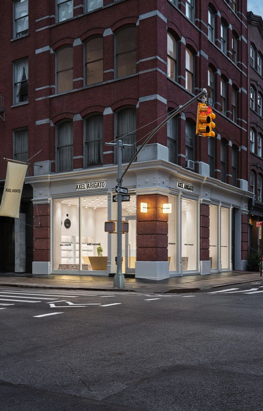 Corner storefront in a New York brick building at dusk