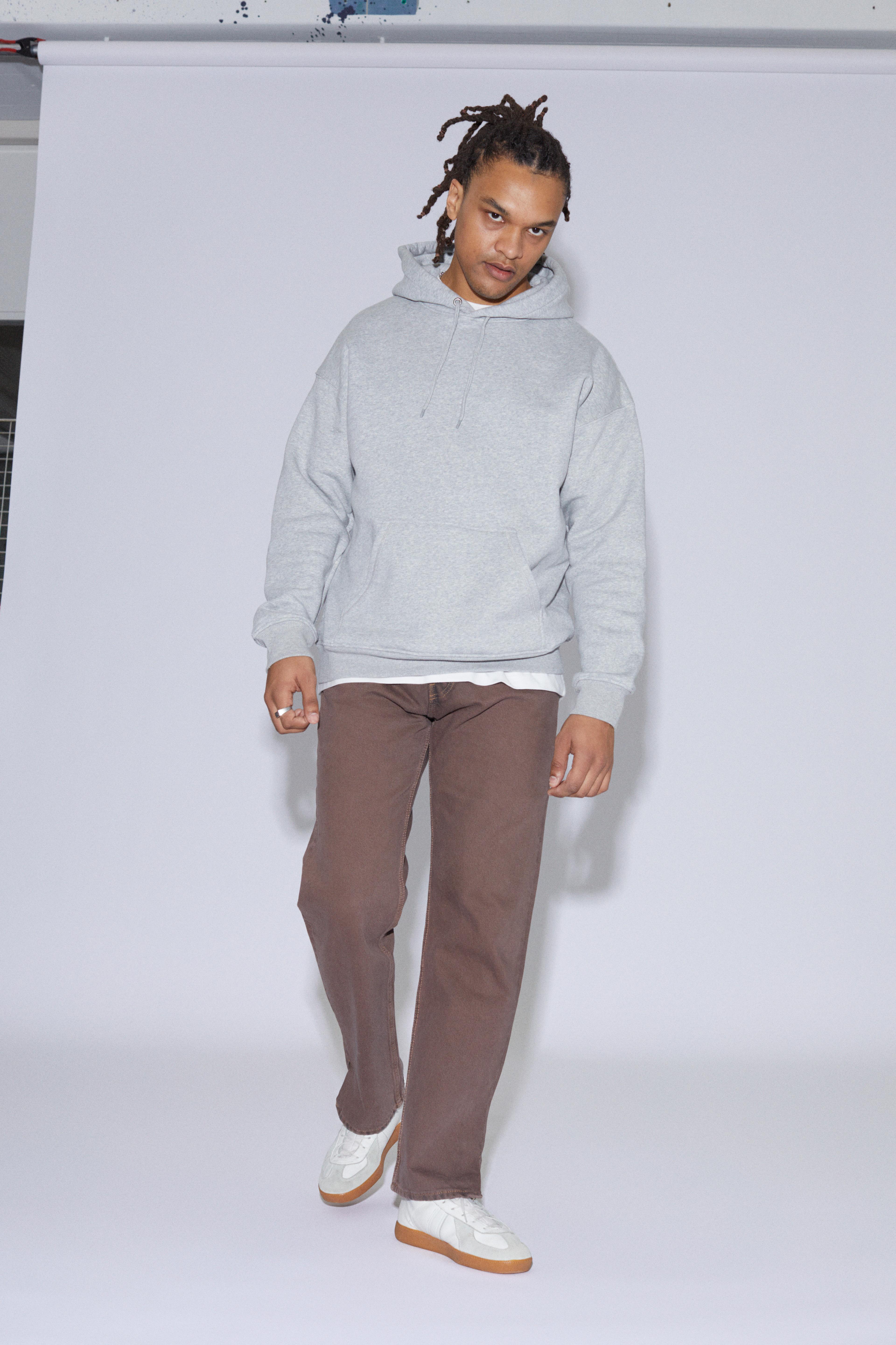 Contemporary collection, man wearing our mens boxy hoodie