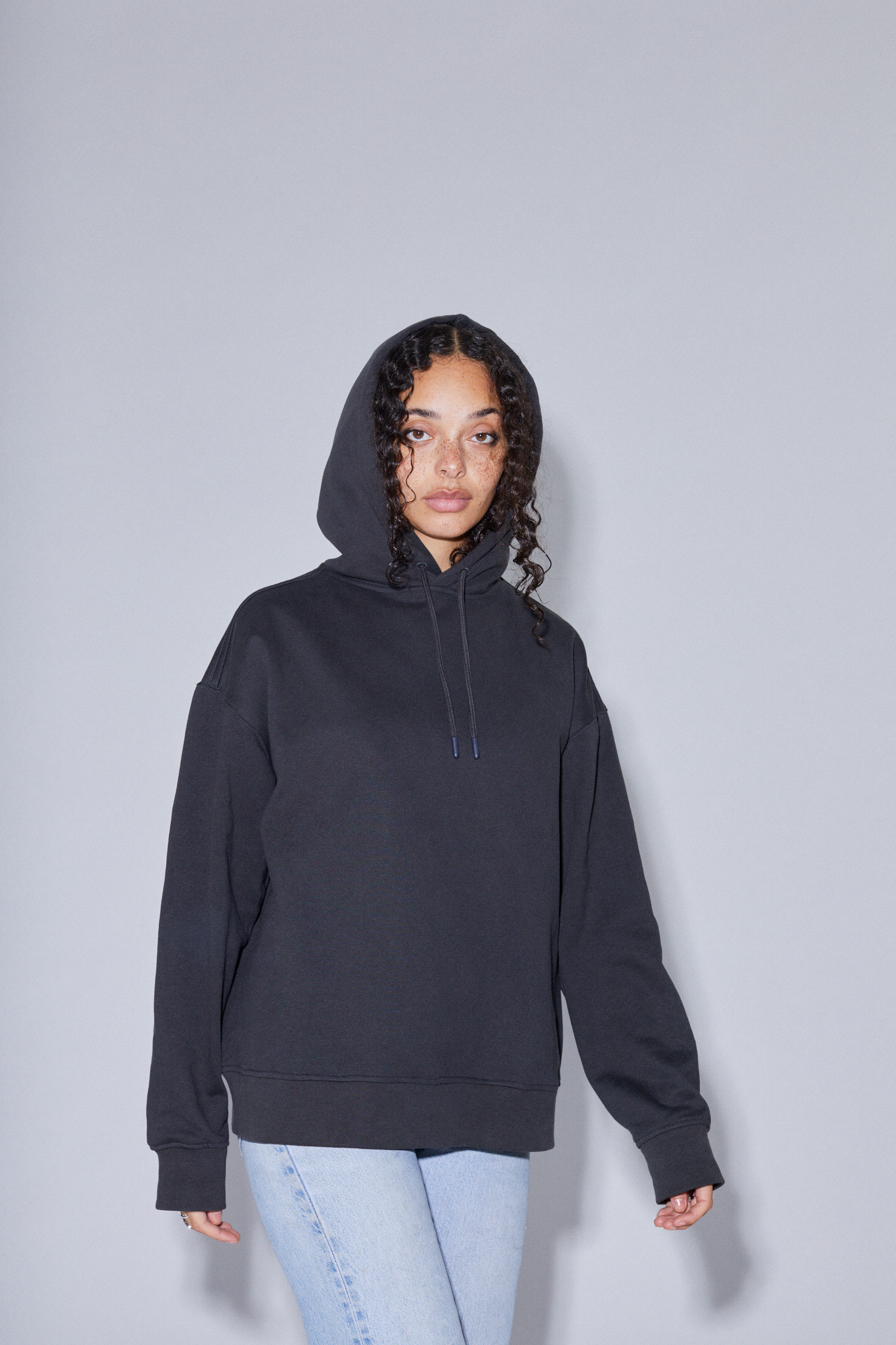 Contemporary collection, woman wearing True Blanks womens oversized hoodie