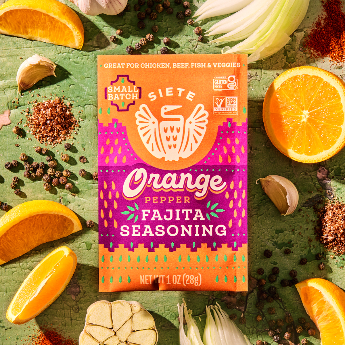 orange pepper seasoning surrounded by ingredients 