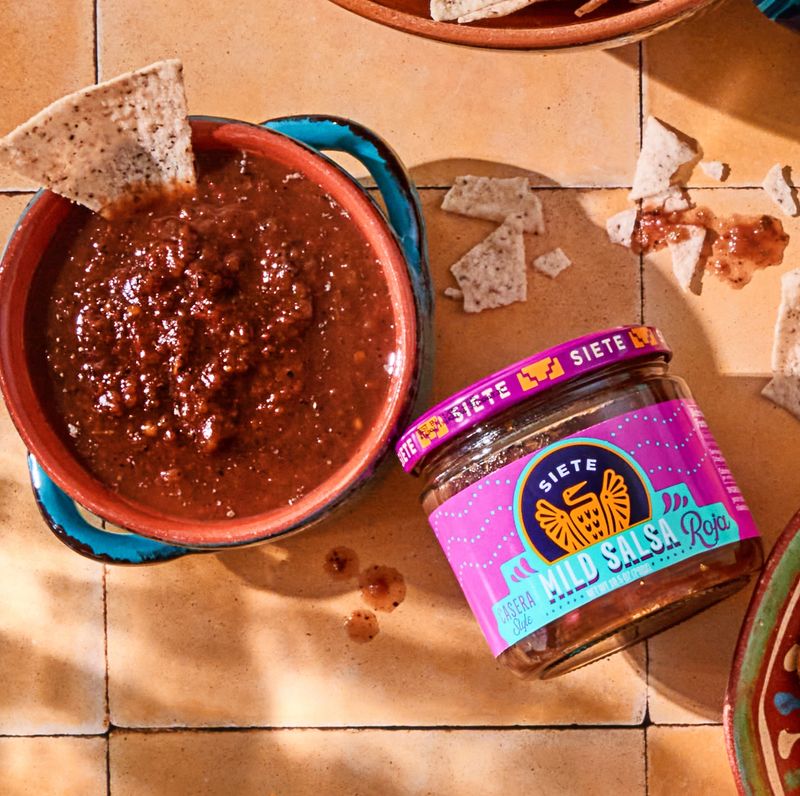 salsa jar laying flat wit fajitas and rice