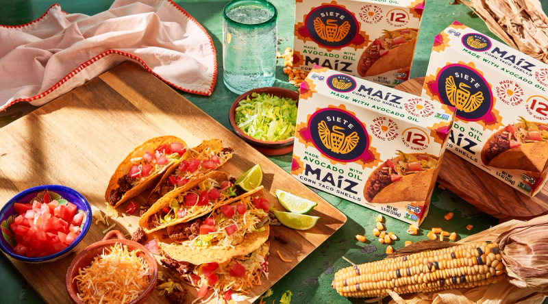 taco shell package with a corn, taco, and taco fillings