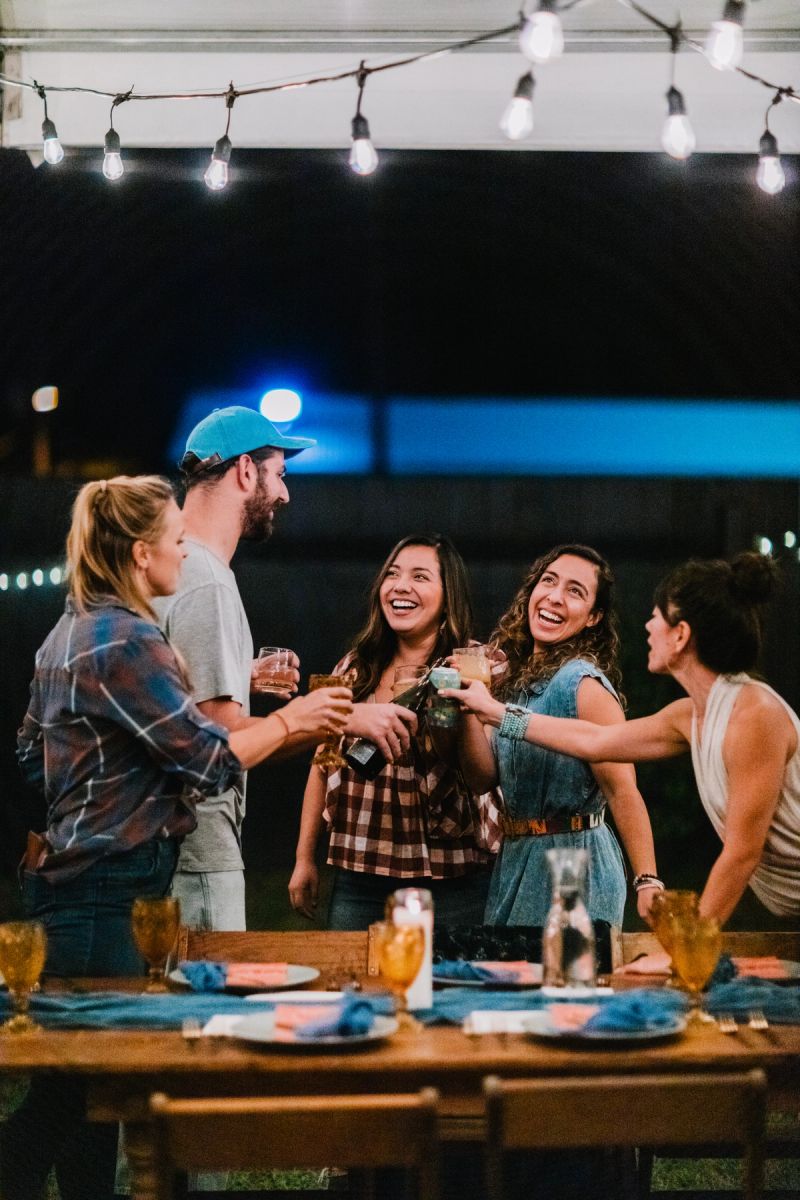 A group of people enjoying drinks outside