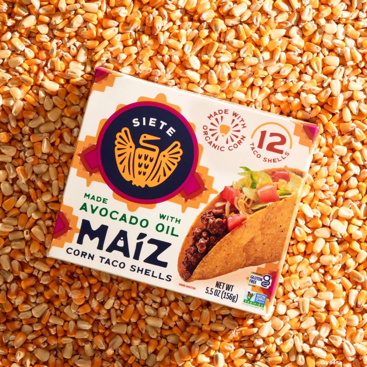 taco shell packaging laying on kernel background 