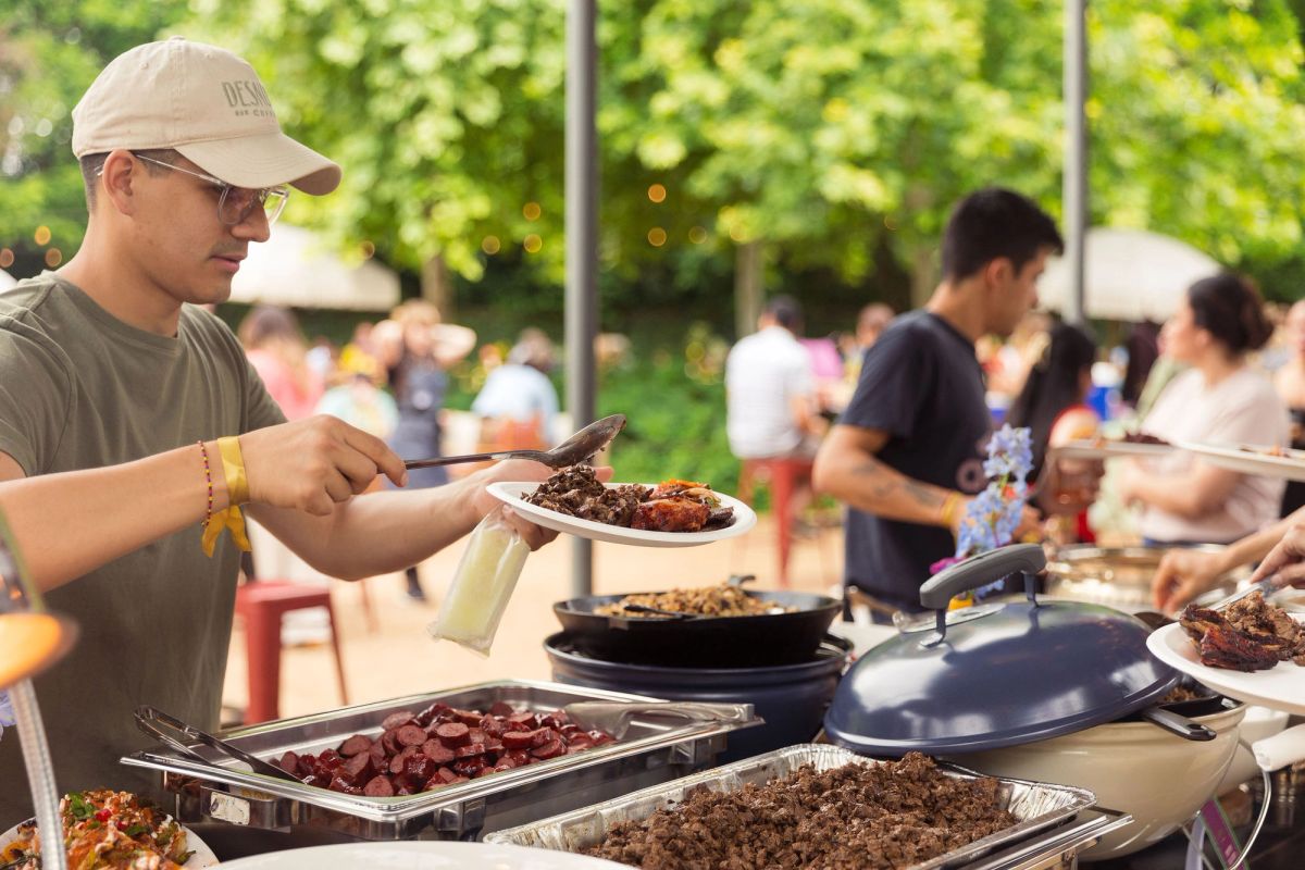 Serving food at a backyard asada
