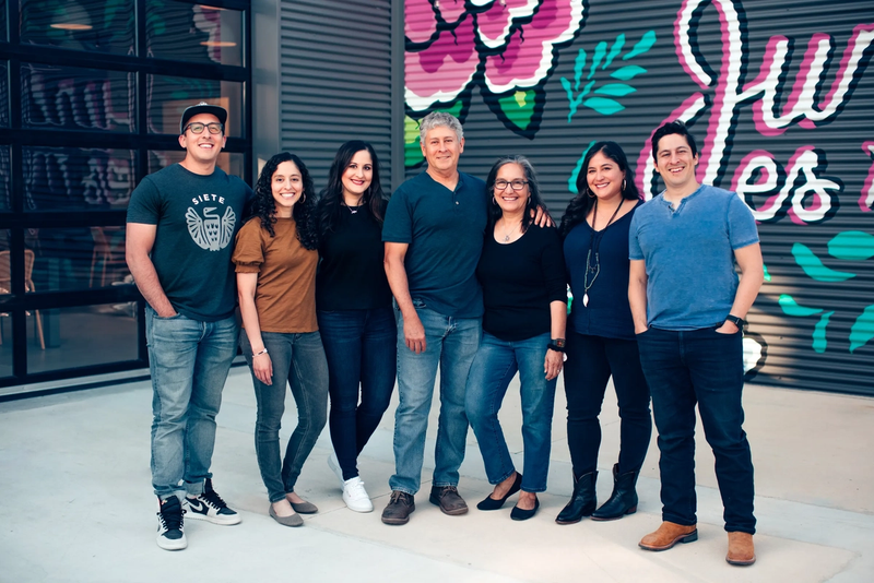 The Garza family posing for a photo together.