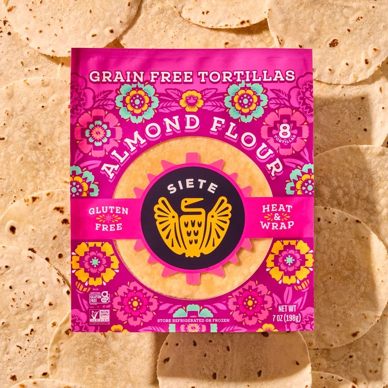 a package of Almond flour tortilla laying flat on a background of tortillas