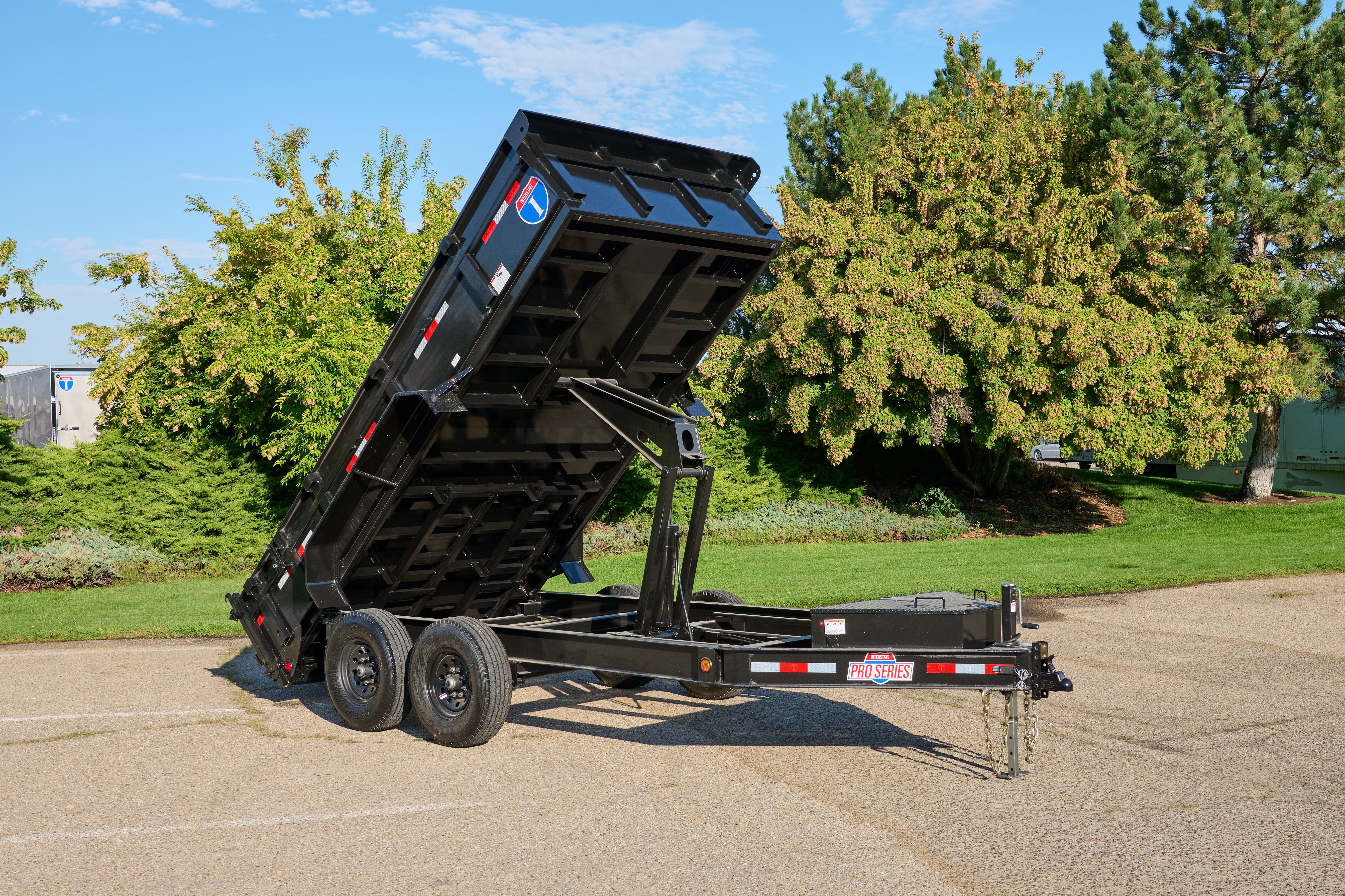 Dump trailer with bed extended upward