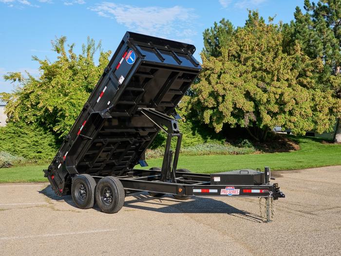 Dump trailer with bed extended upward