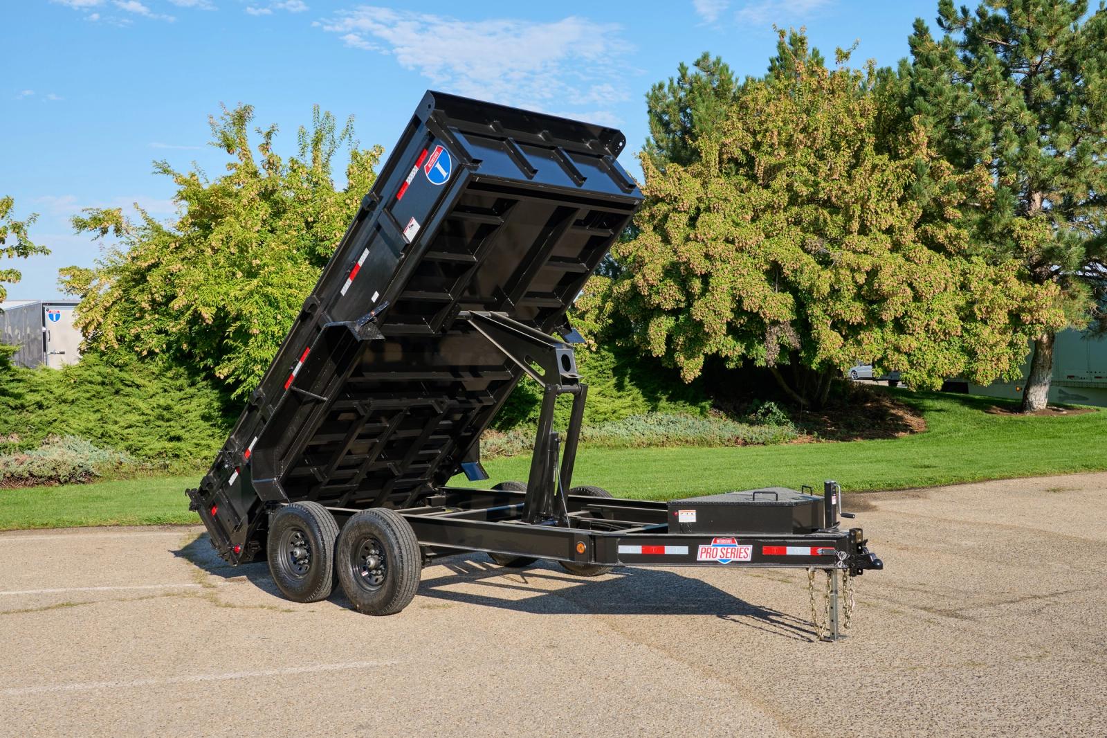 Dump trailer with bed extended upward