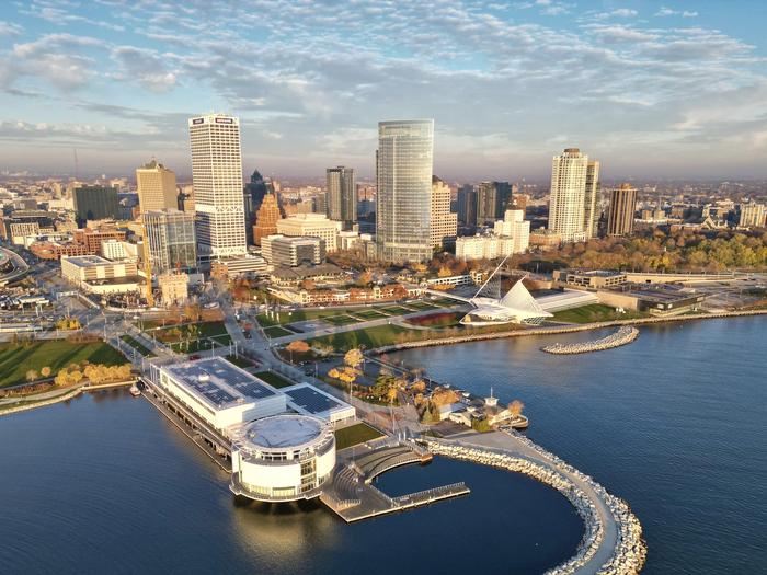 Aerial view of the Milwaukee skyline along Lake Michigan with the white-winged Milwaukee Art Museum and downtown high-rises