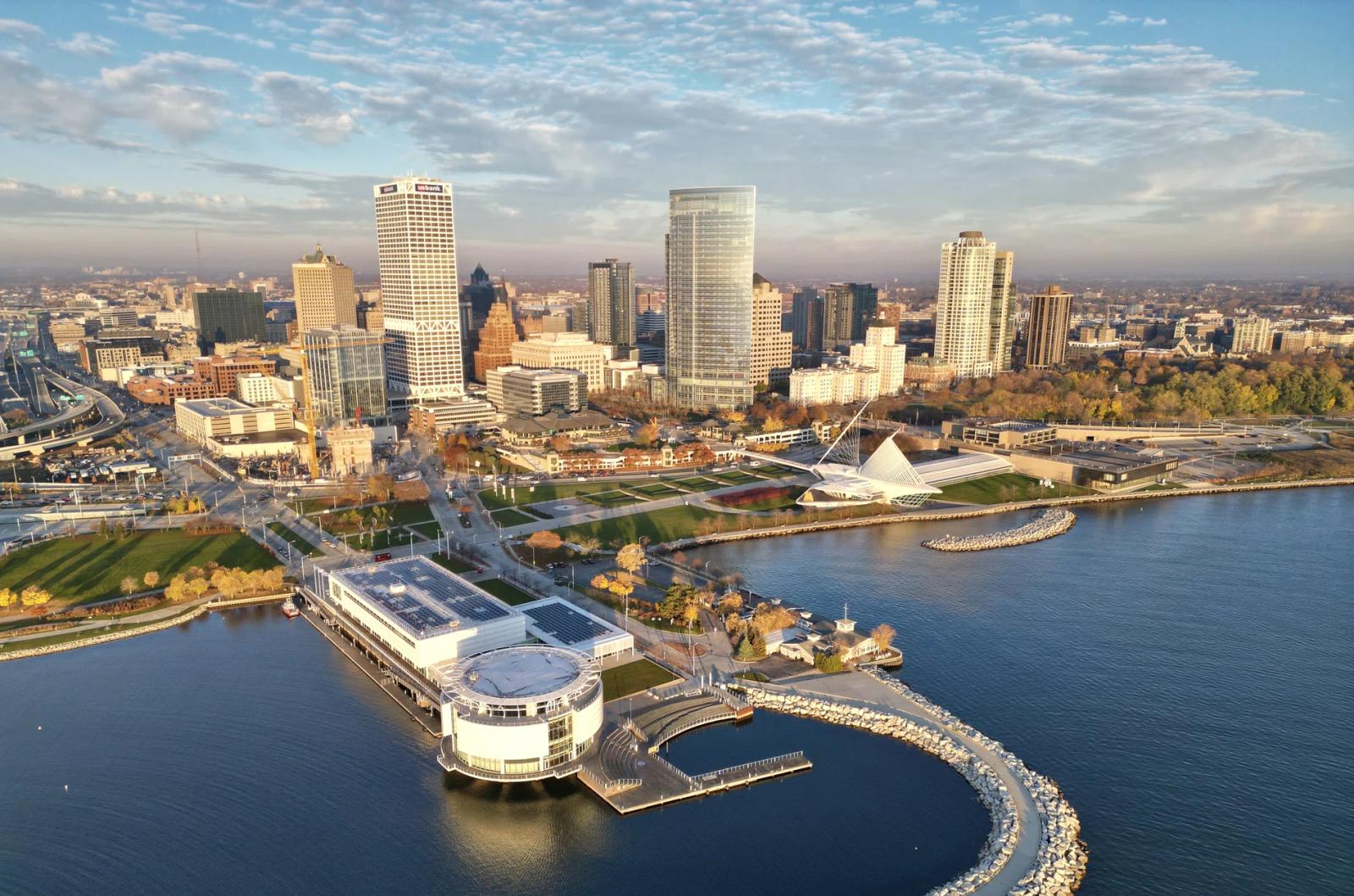Aerial view of the Milwaukee skyline along Lake Michigan with the white-winged Milwaukee Art Museum and downtown high-rises