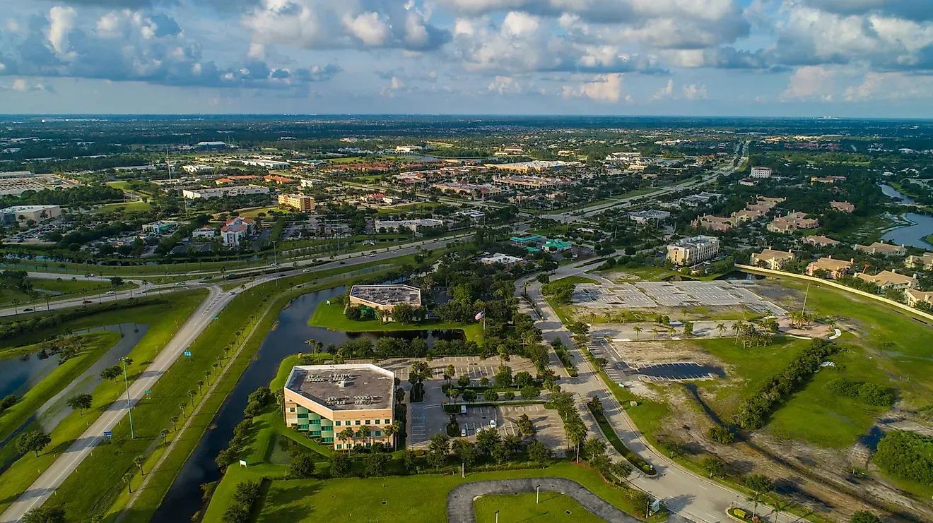 Aerial view of a Florida suburban office park with greenways, retention ponds, and mid-rise commercial buildings