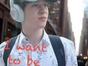 Halen, a teenage boy wearing a floral shirt, baseball cap, and Beats headphones, walks along a city street with a backpack. Text overlay reads "I want to be..."