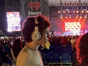 Halen wearing headphones and enjoying the Rick Springfield concert at an outdoor venue
