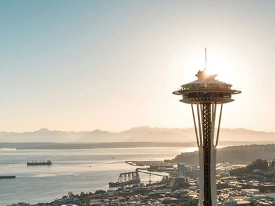 Seattle’s Space Needle overlooking the city and Puget Sound at sunset