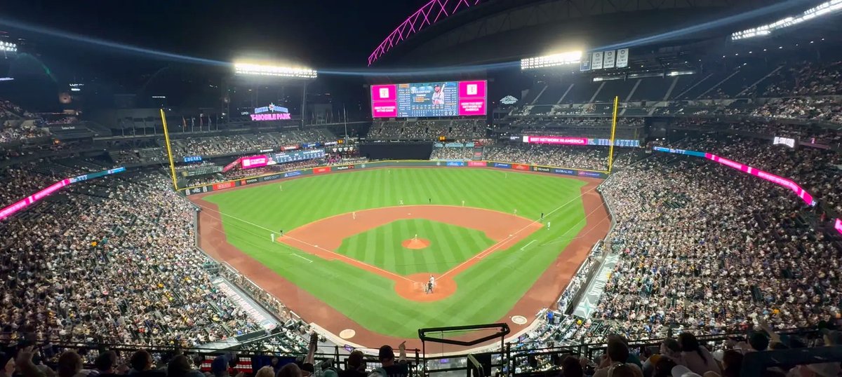 T-Mobile Park in Seattle during a Mariners night game, viewed from the upper deck behind home plate