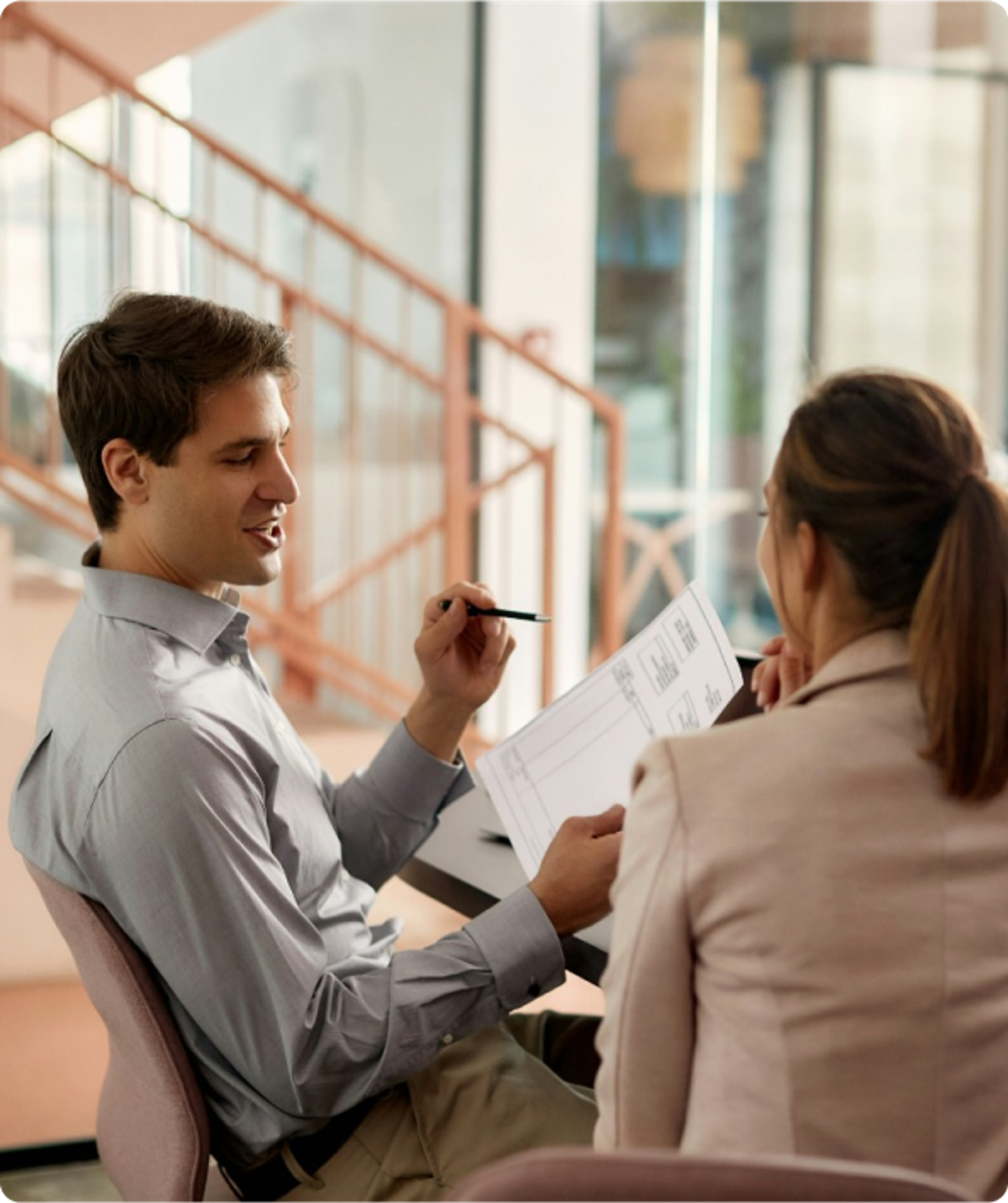 Couple discussing paperwork at home