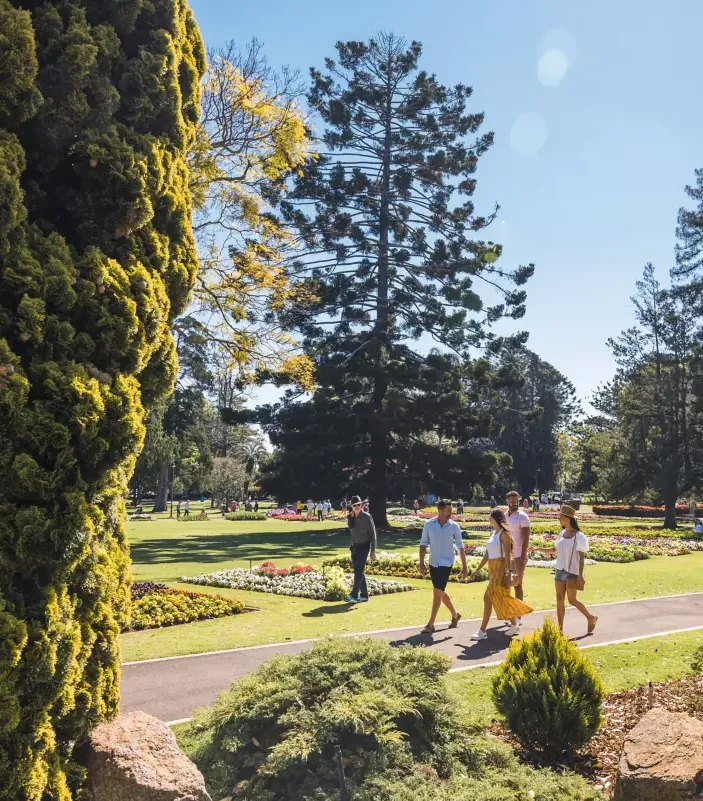 Friends walking in a park in Toowoomba