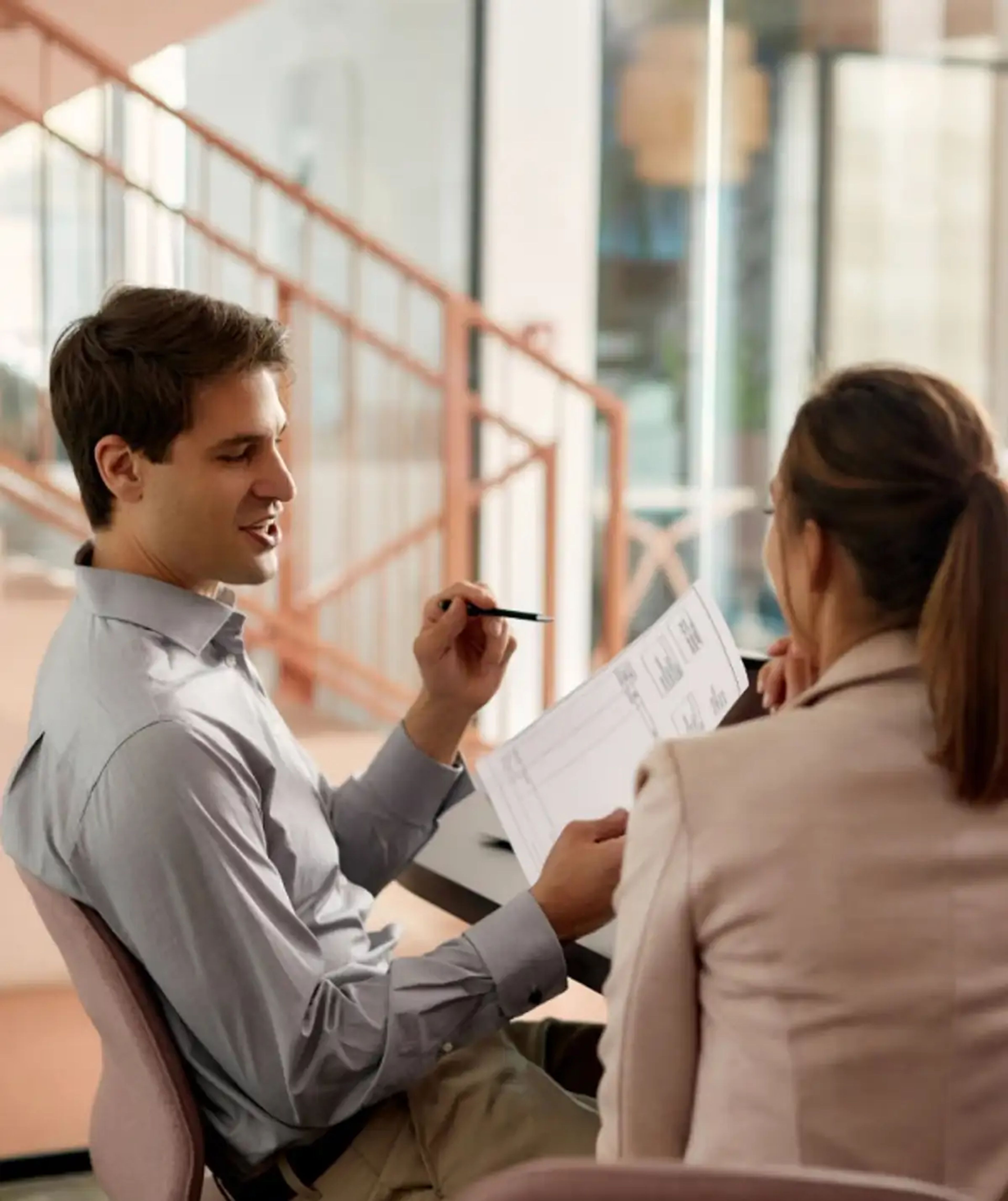 Couple discussing paperwork at home