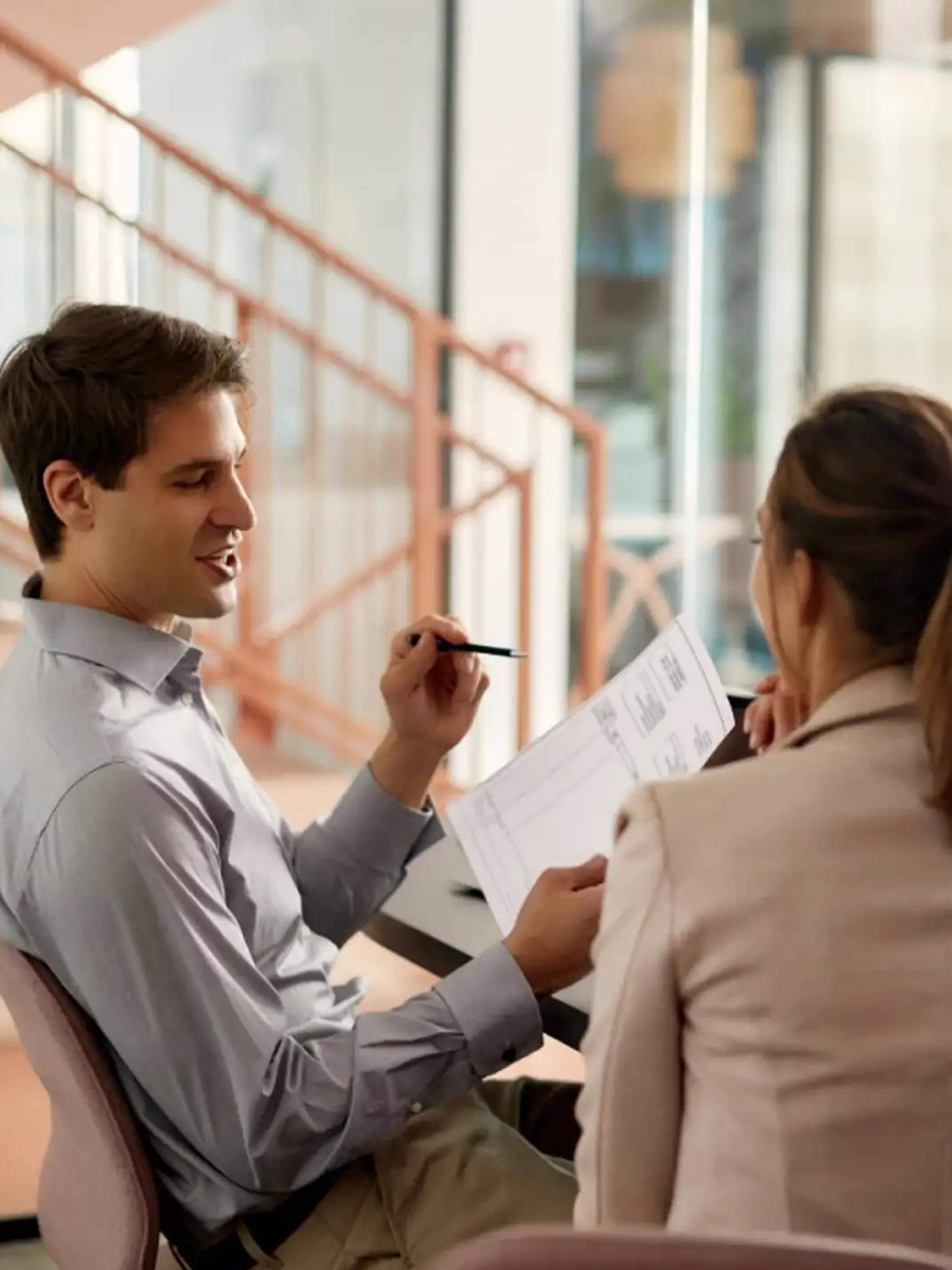 Couple discussing paperwork at home