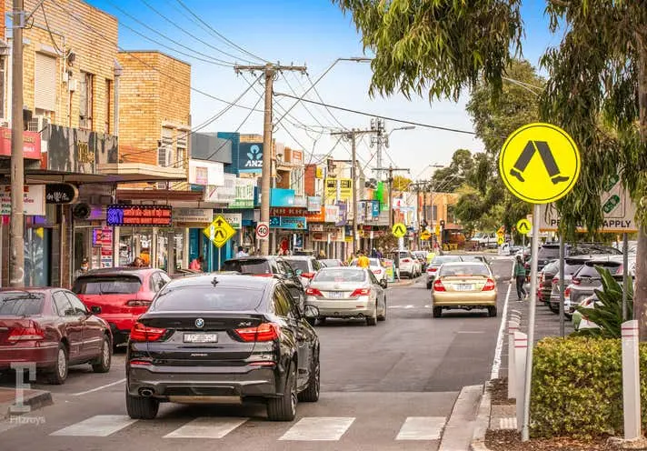 St Albans street with cars and shops