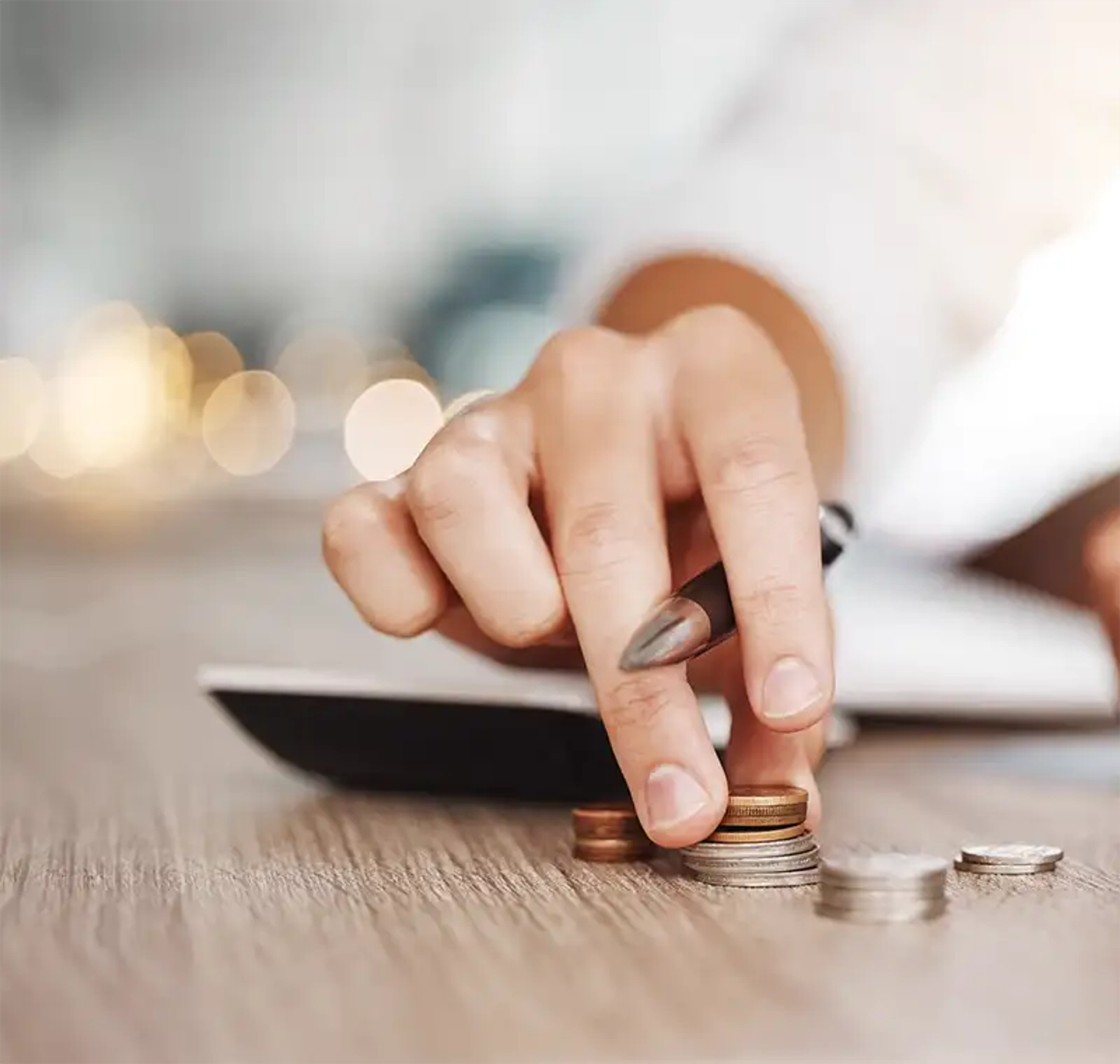 Counting small change on the table with a blurred background