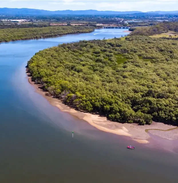 River with bushland and hills in the distance