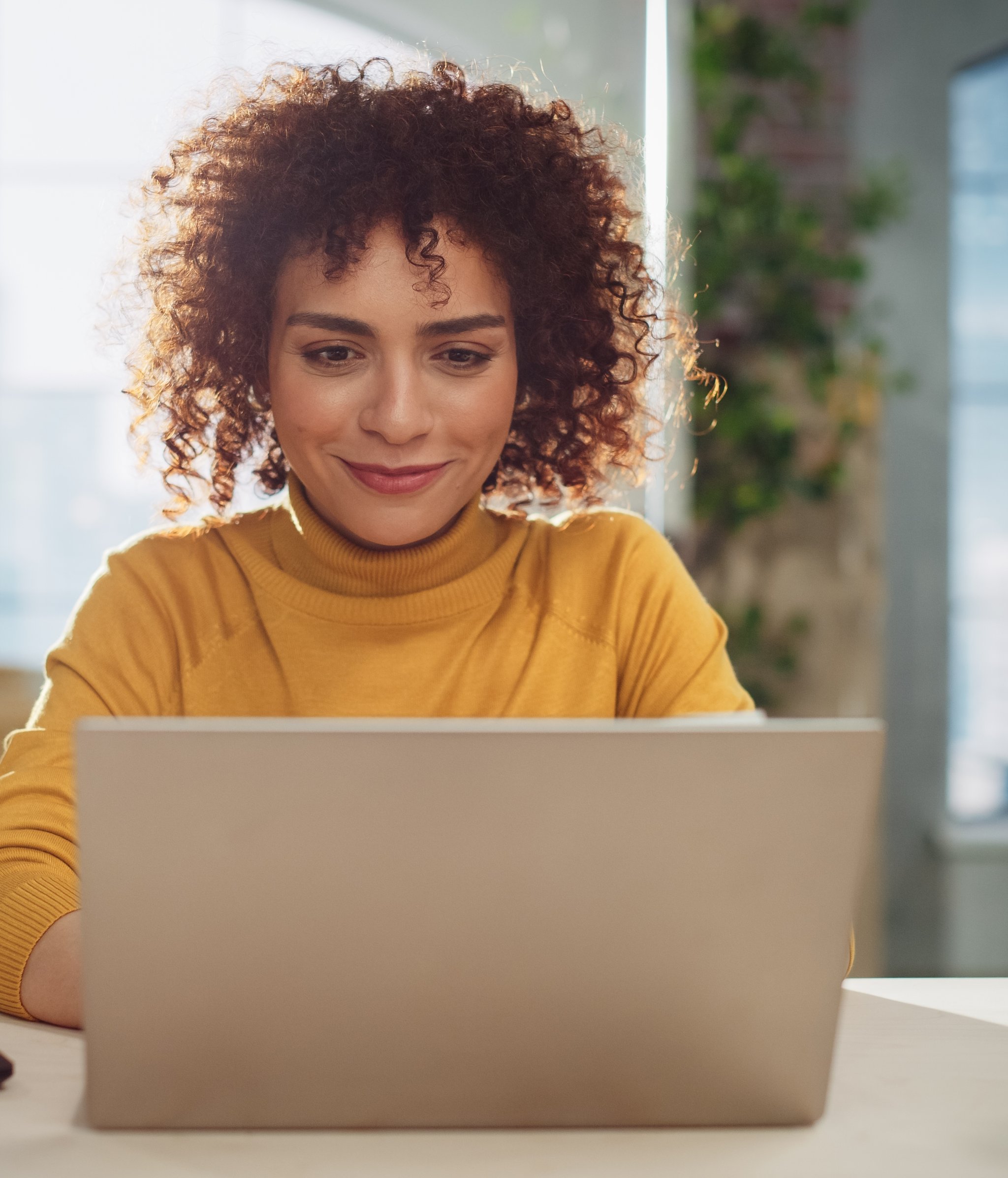 Young woman checking her laptop