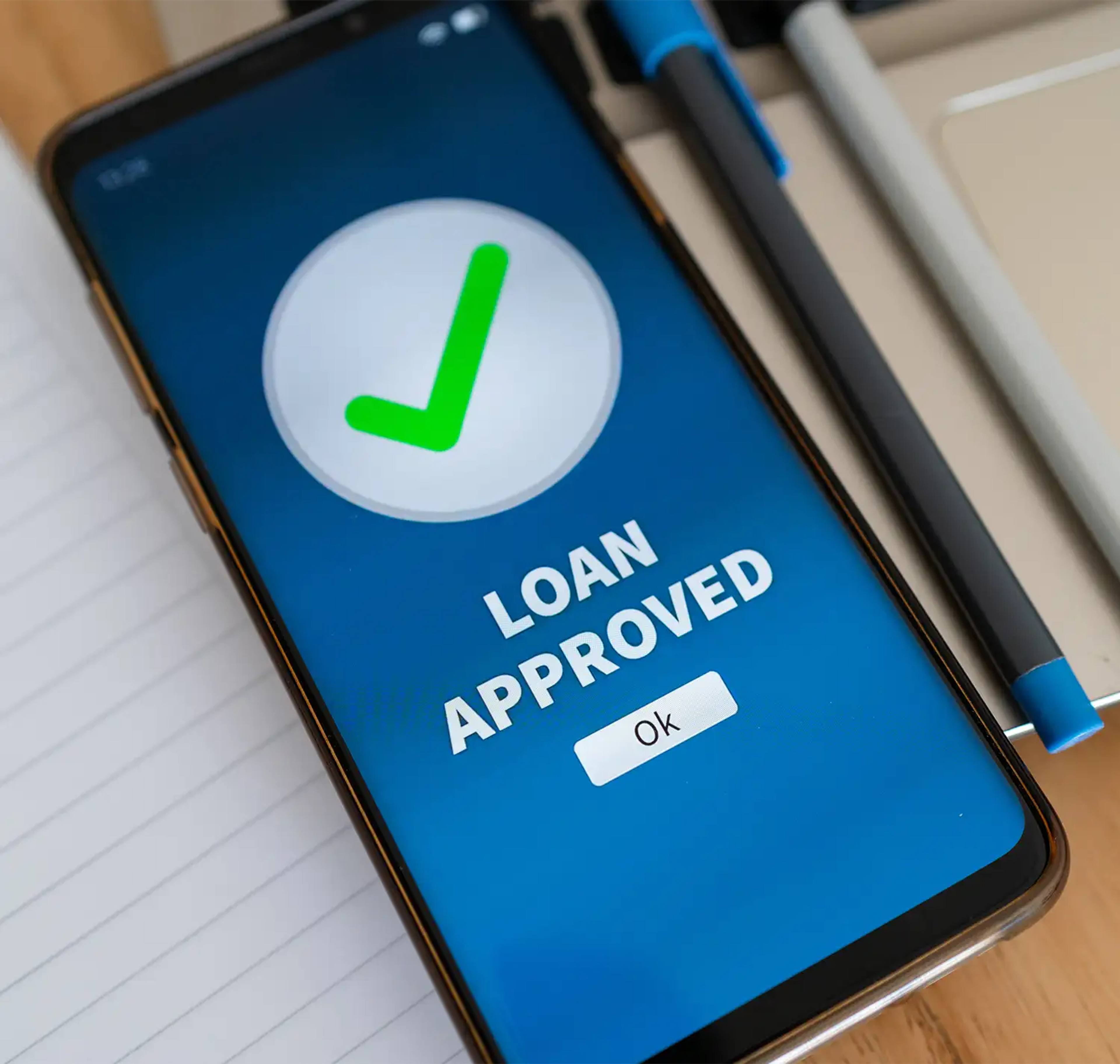 Mobile phone screen displaying a loan approved message